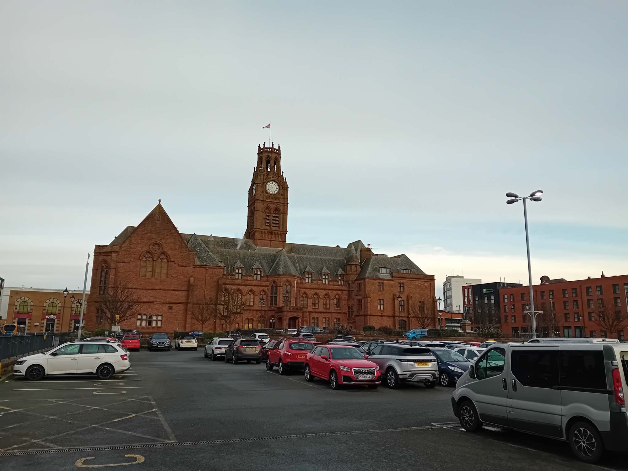 A town hall with a central clock tower