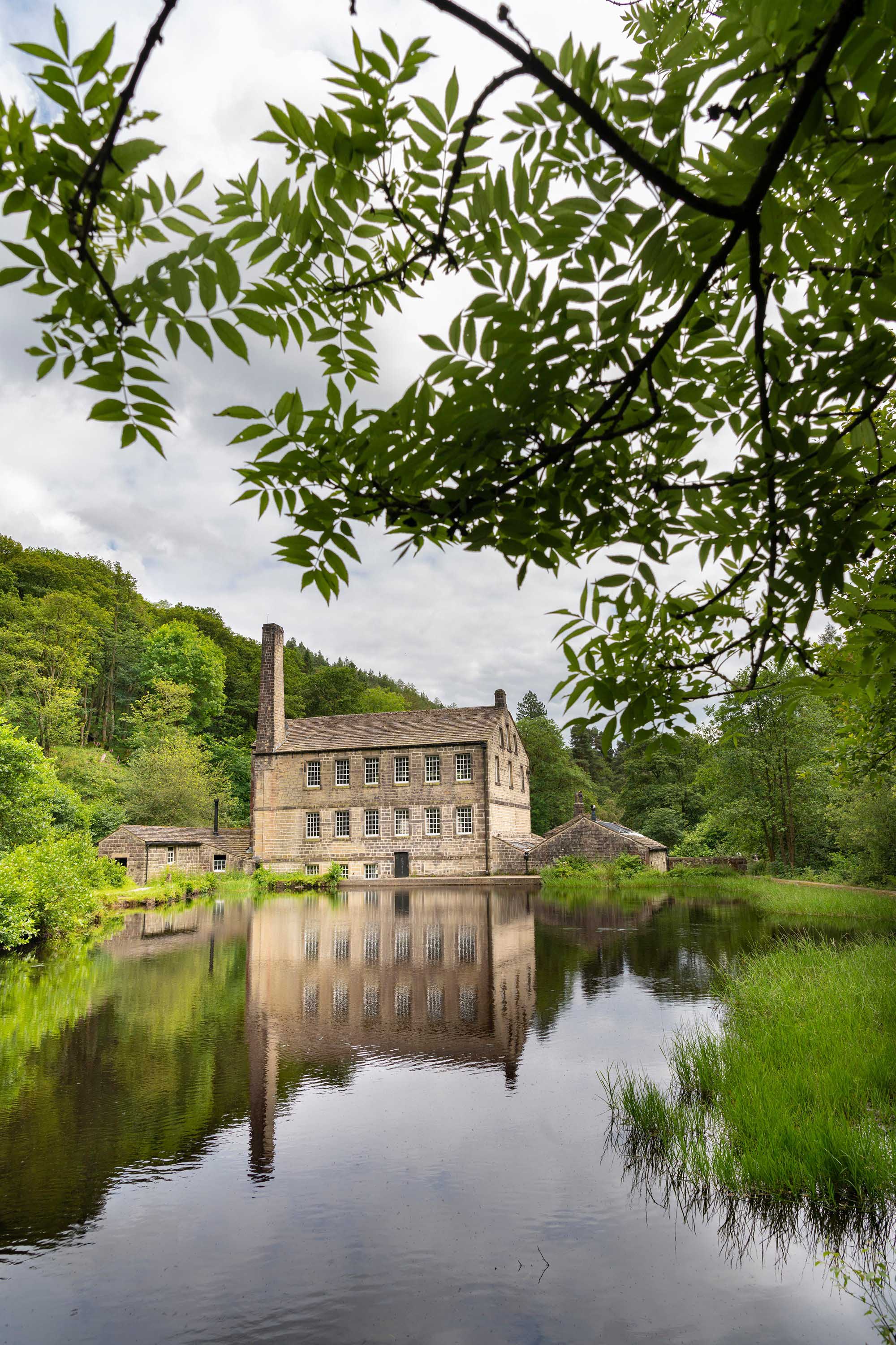 Photo of Gibson Mill from across a pond