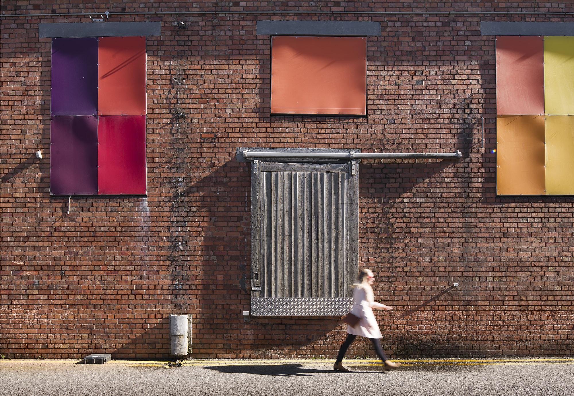 Person walking past The Paintworks