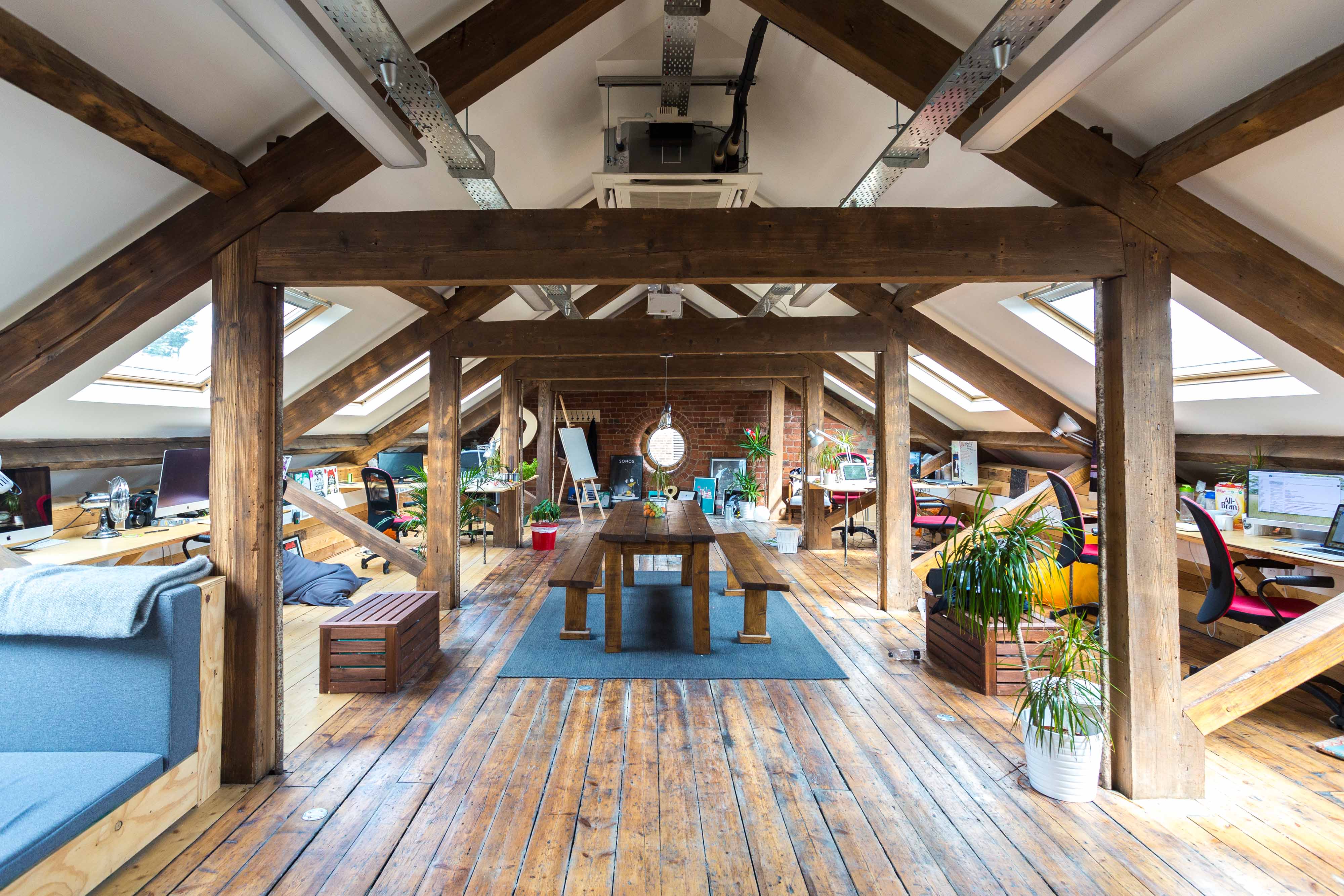 The loft space after conversion, with the circular window revealed