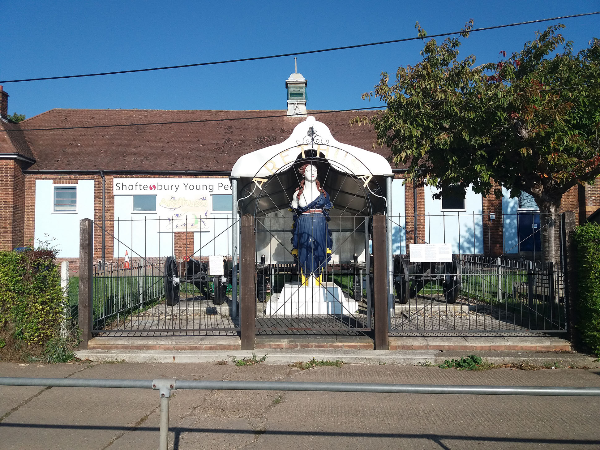 Front view of figurehead enclosed by metal railings