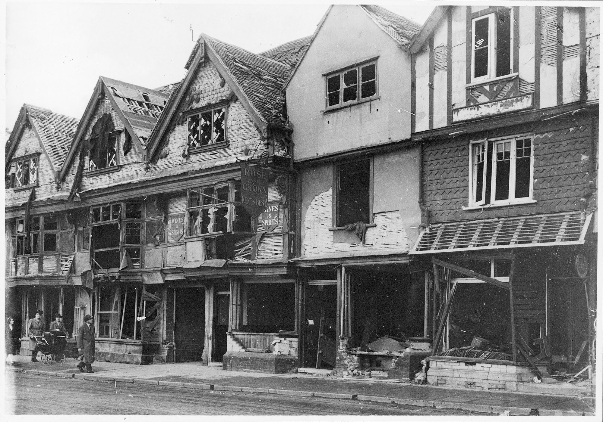 Timber framed buildings with their windows blown out
