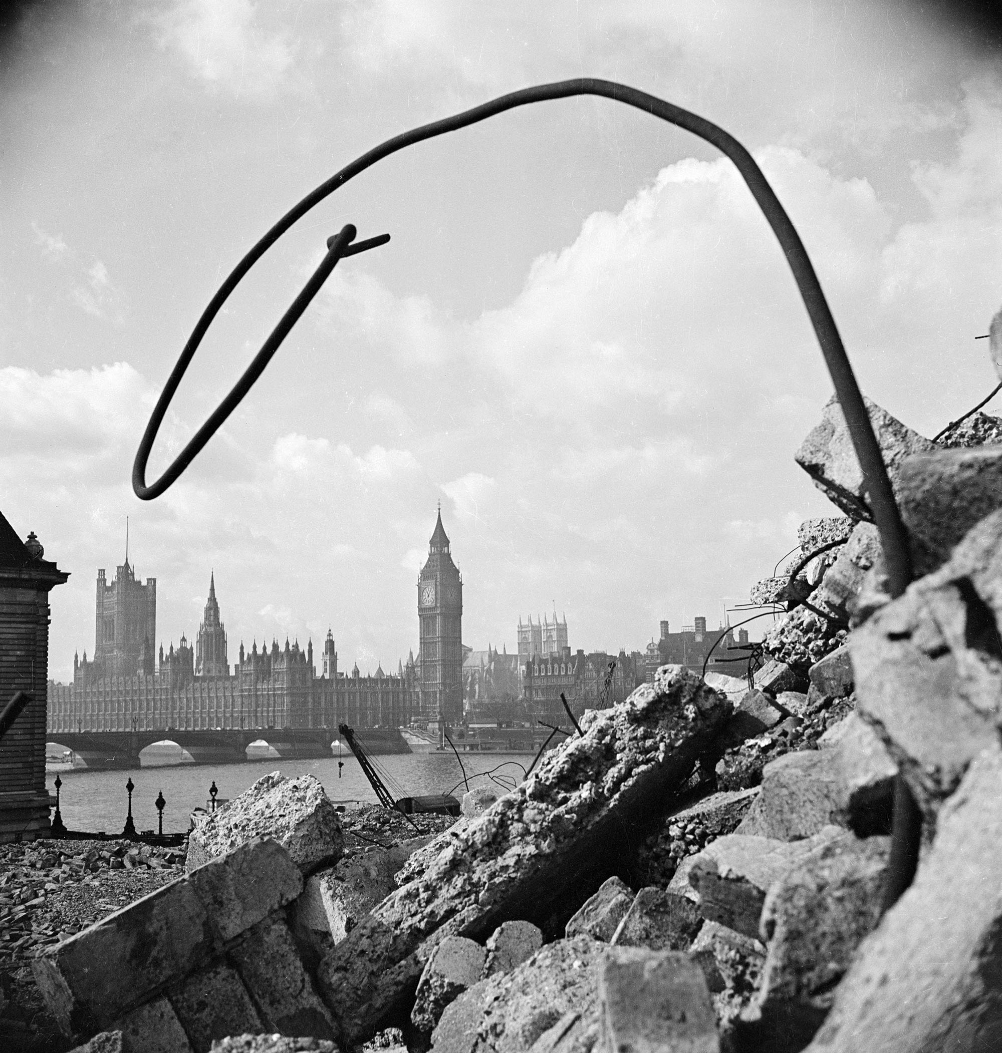 View of Big Ben and the Houses of Parliament through rubble in the foreground