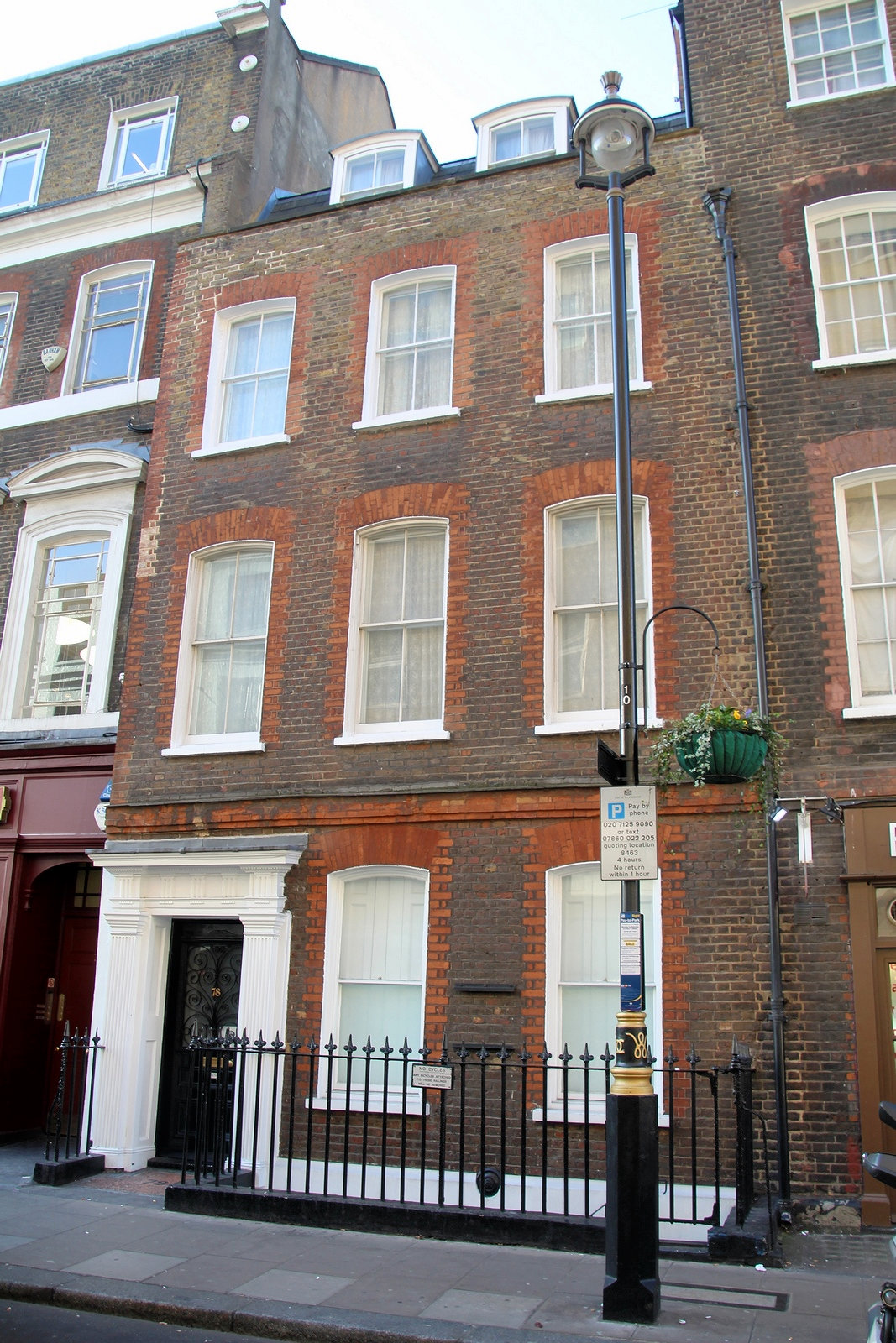 Georgian house with railings outside.