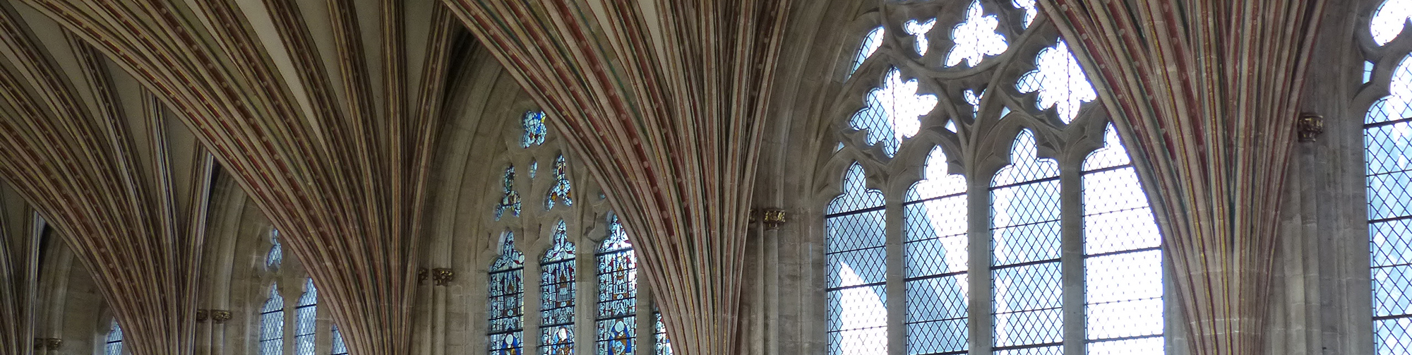 interior view of a cathedral church showing stained glass windows