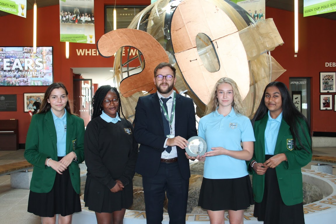 Sydney Russell School pupils with Aris Dimakos, Assistant Vice Principal, with their Champion Heritage School Award
