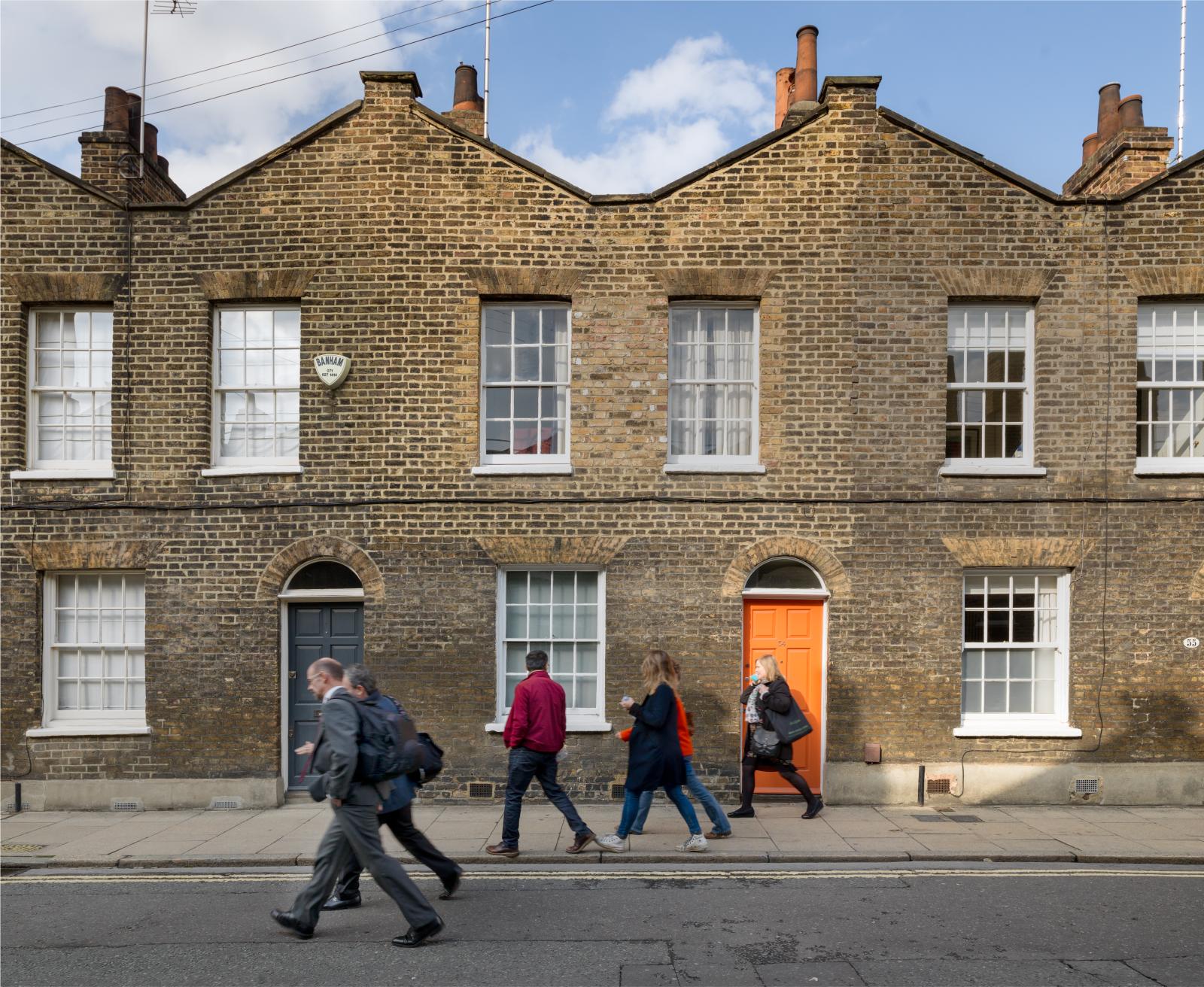 Pedestrians walking along a street.