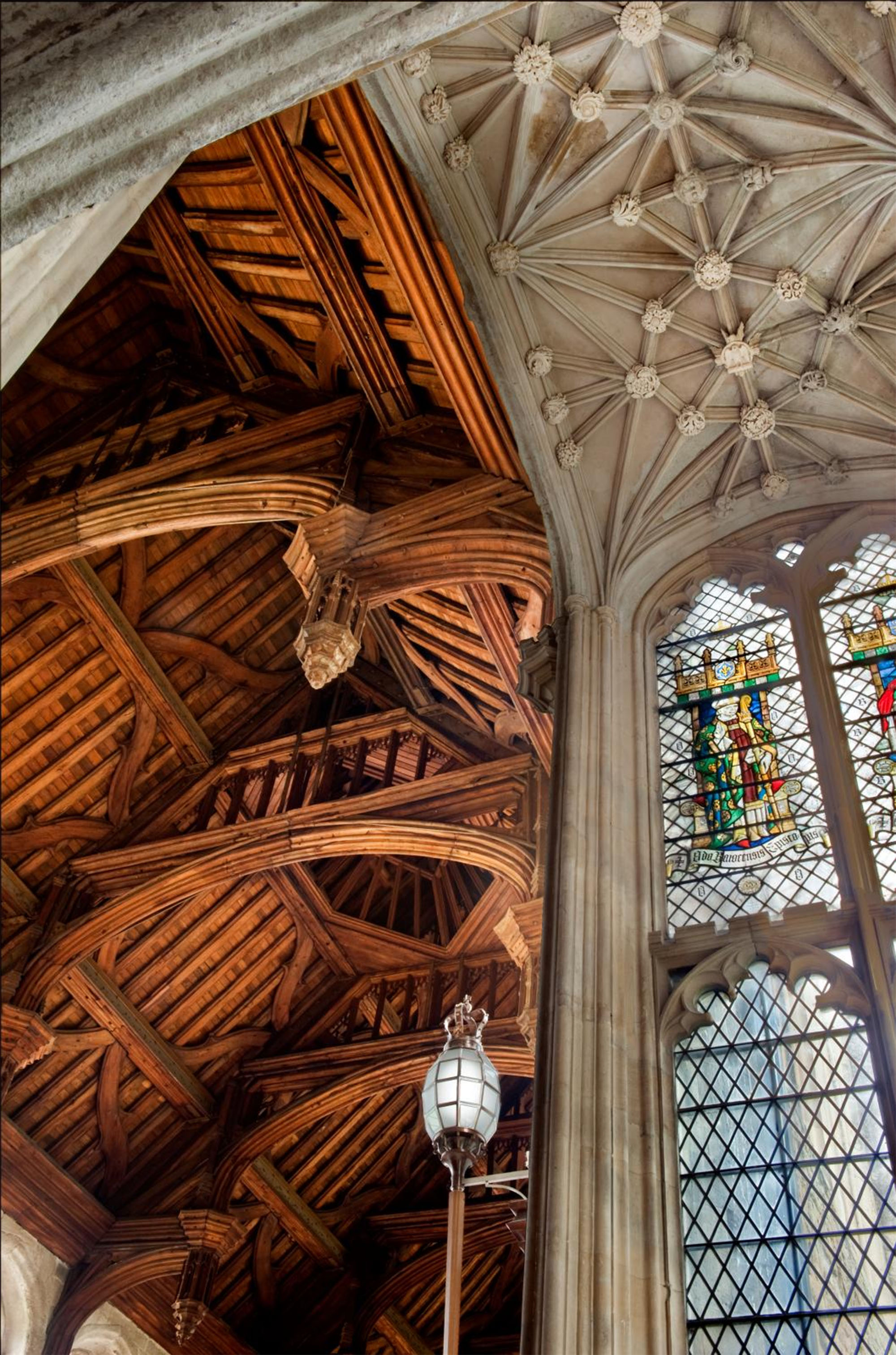 The ceiling and stained glass windows of the Great Hall at Eltham Palace.