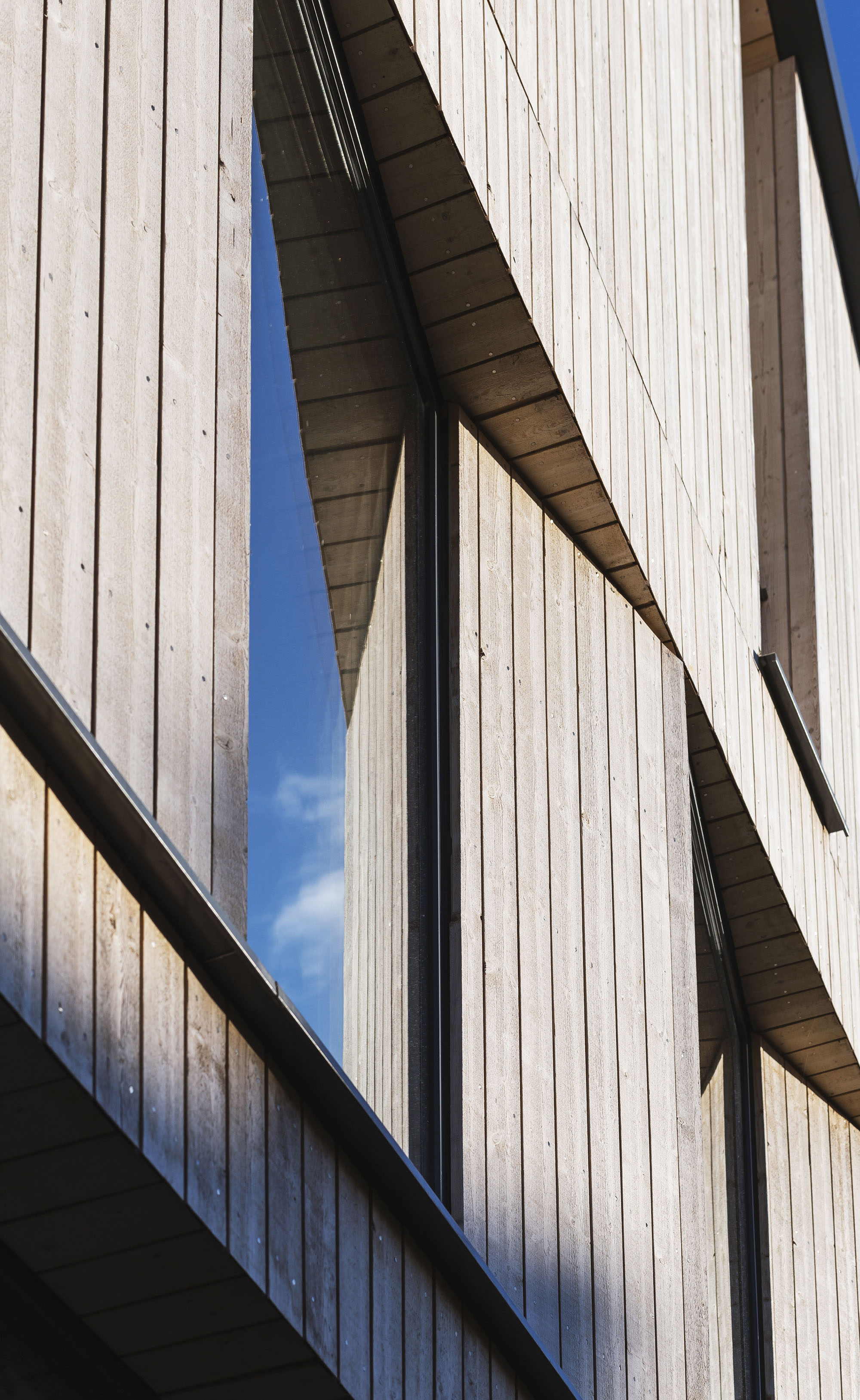 Detail of exterior wooden wall panelling and window