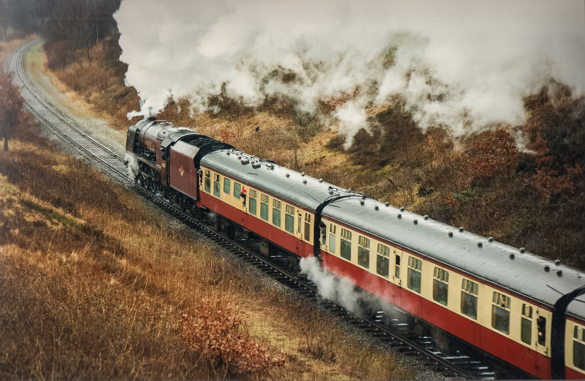 A train on the East Lancashire Light Railway emitting a plume of smoke.