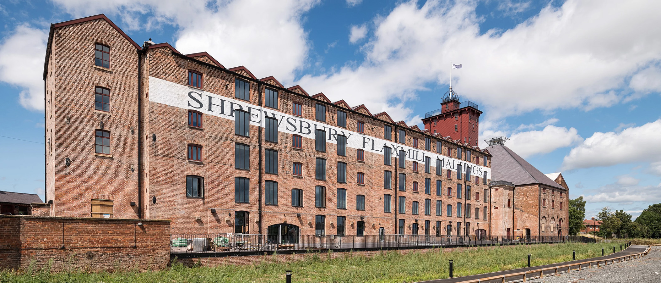 A large brick mill building 