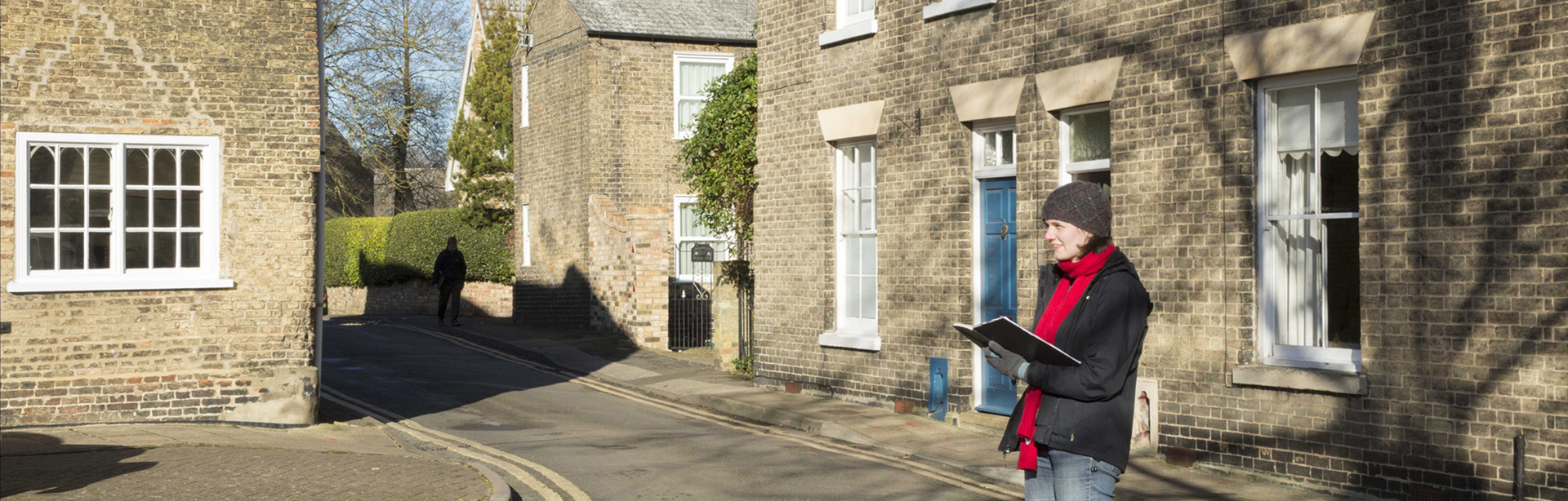 Investigator standing in the street in Ely, Cambridgshire