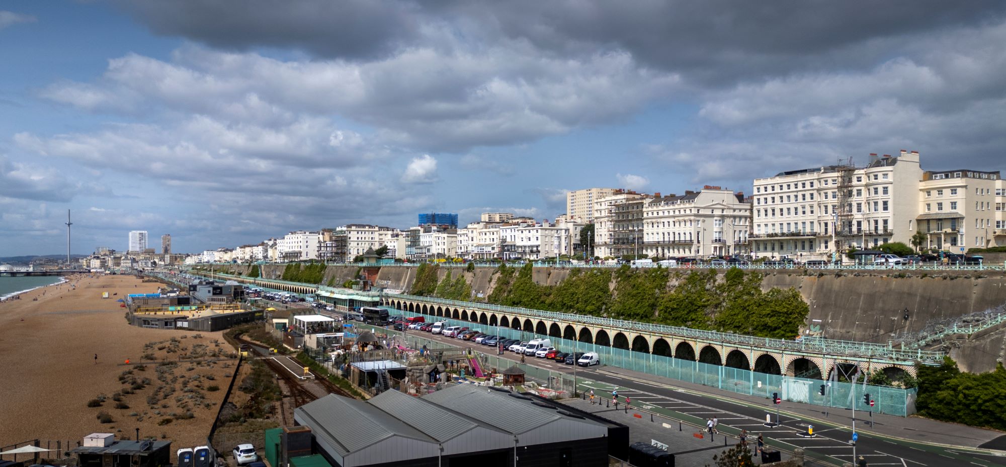 Drone view of buildings and structures on the seafront in Brighton, UK.
