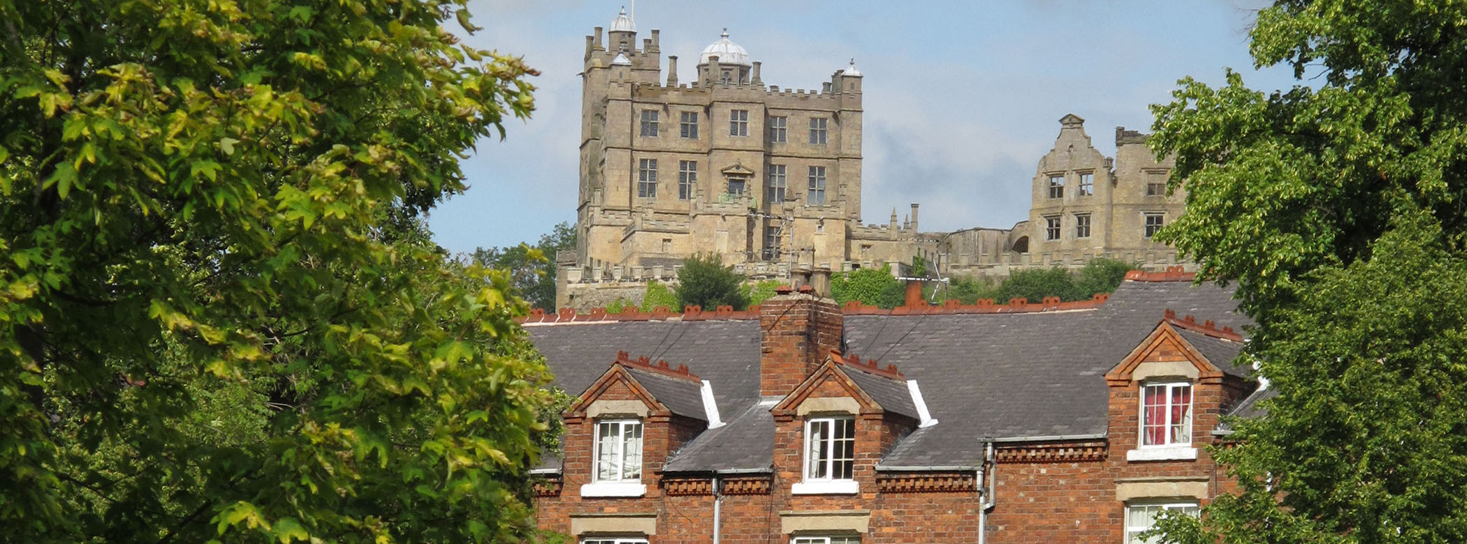 New Bolsover Model Village, Derbyshire, where much of Historic England’s research into energy performance and the effects of measures to increase energy efficiency is being carried out. Bolsover Castle is visible in the background