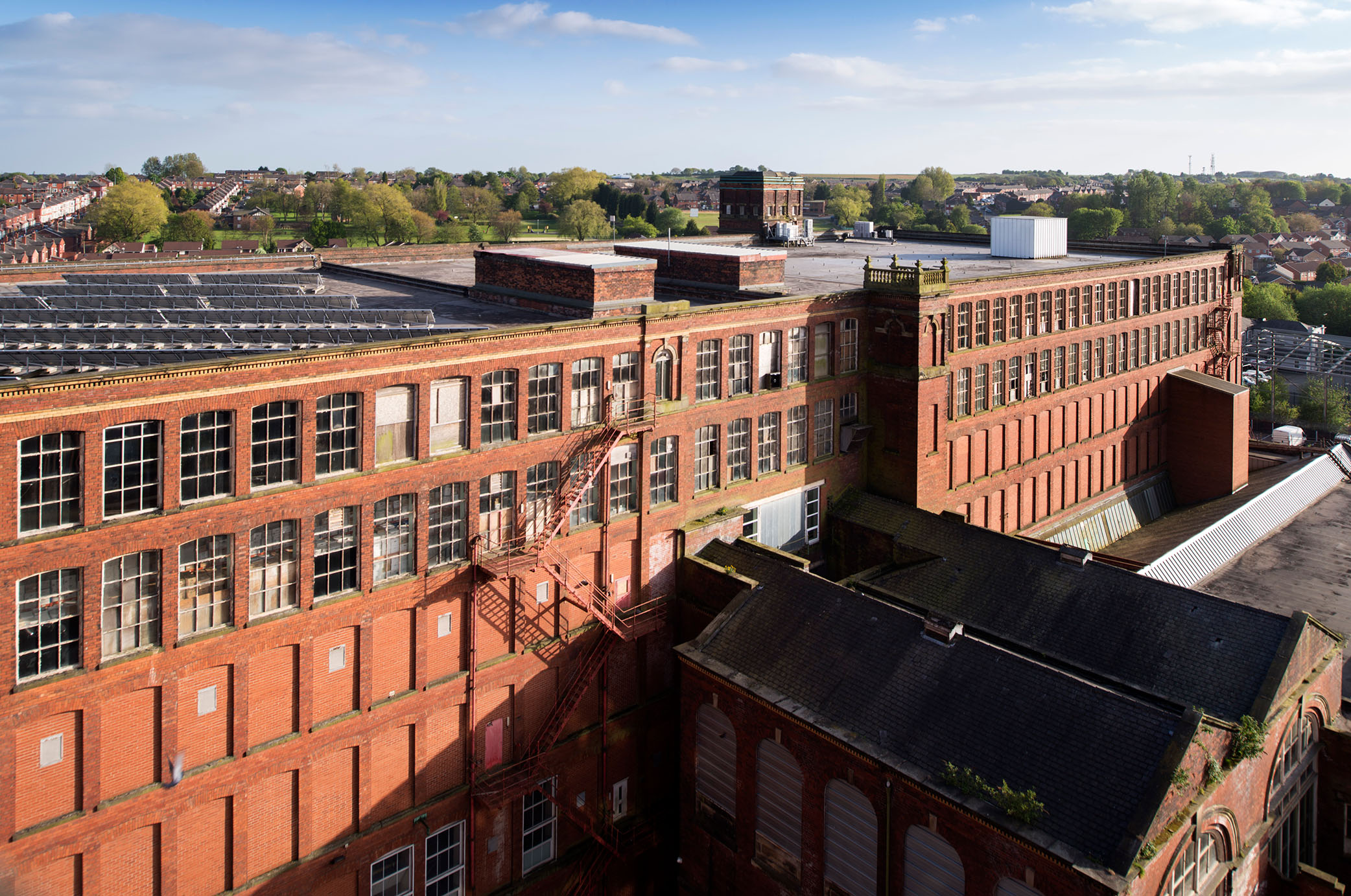 Swan Lane Mill in Bolton, Lancashire. This huge complex comprises three Grade II* listed buildings. When the second mill was completed in the early 1900s it was said to be the largest cotton spinning complex in the world. The building is currently on Historic England's Heritage at Risk Register.