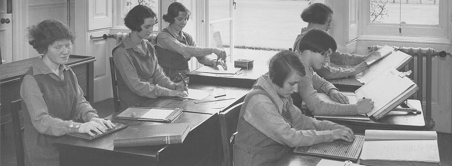 Girls in a classroom at Worcester College for the Blind