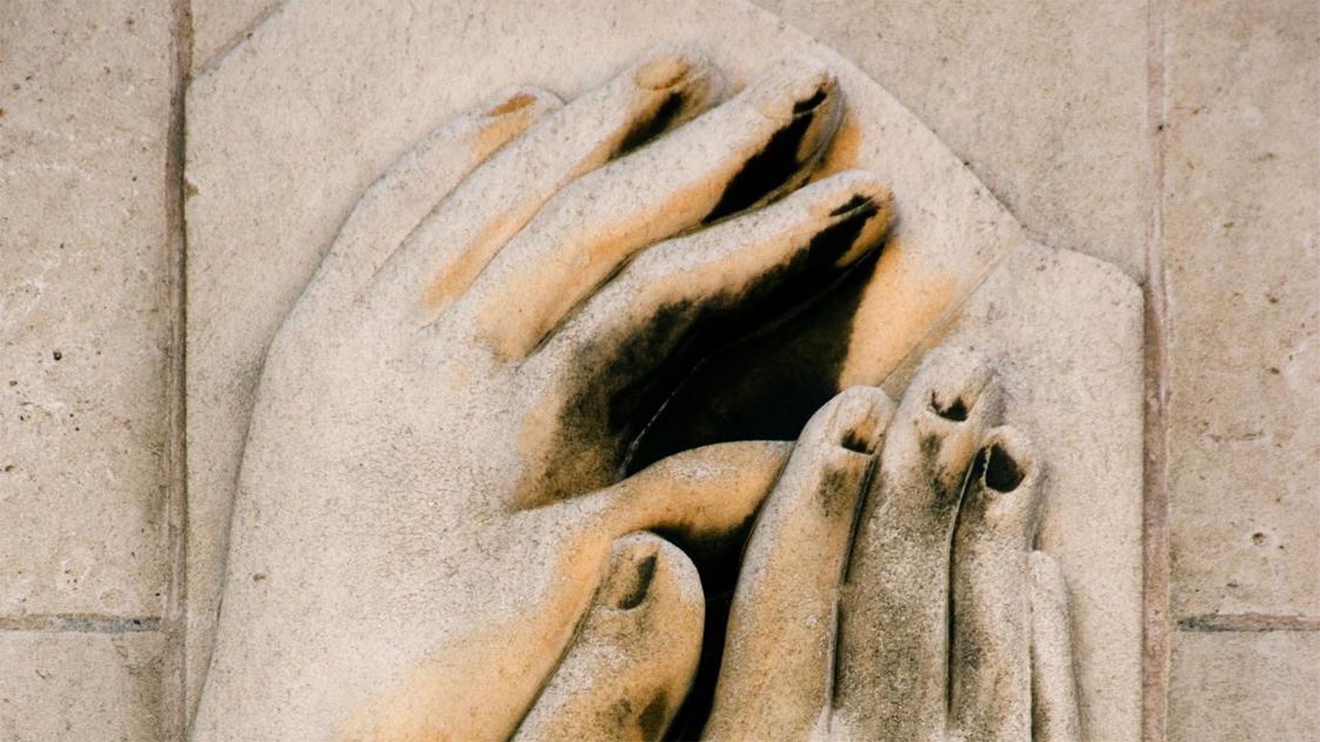 Carved stone hands