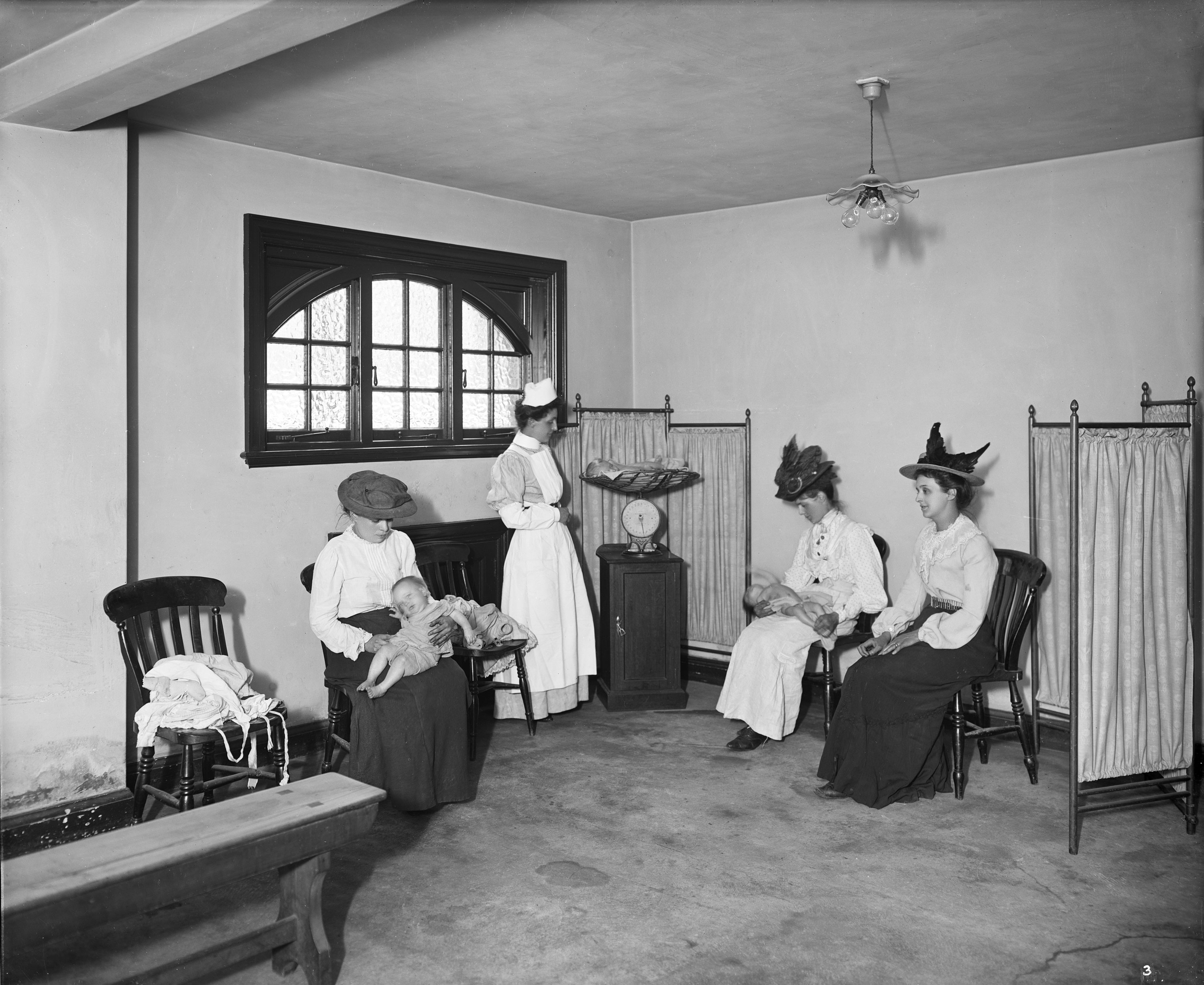 Babies being weighed in the reception room of an infants hospital in 1908.