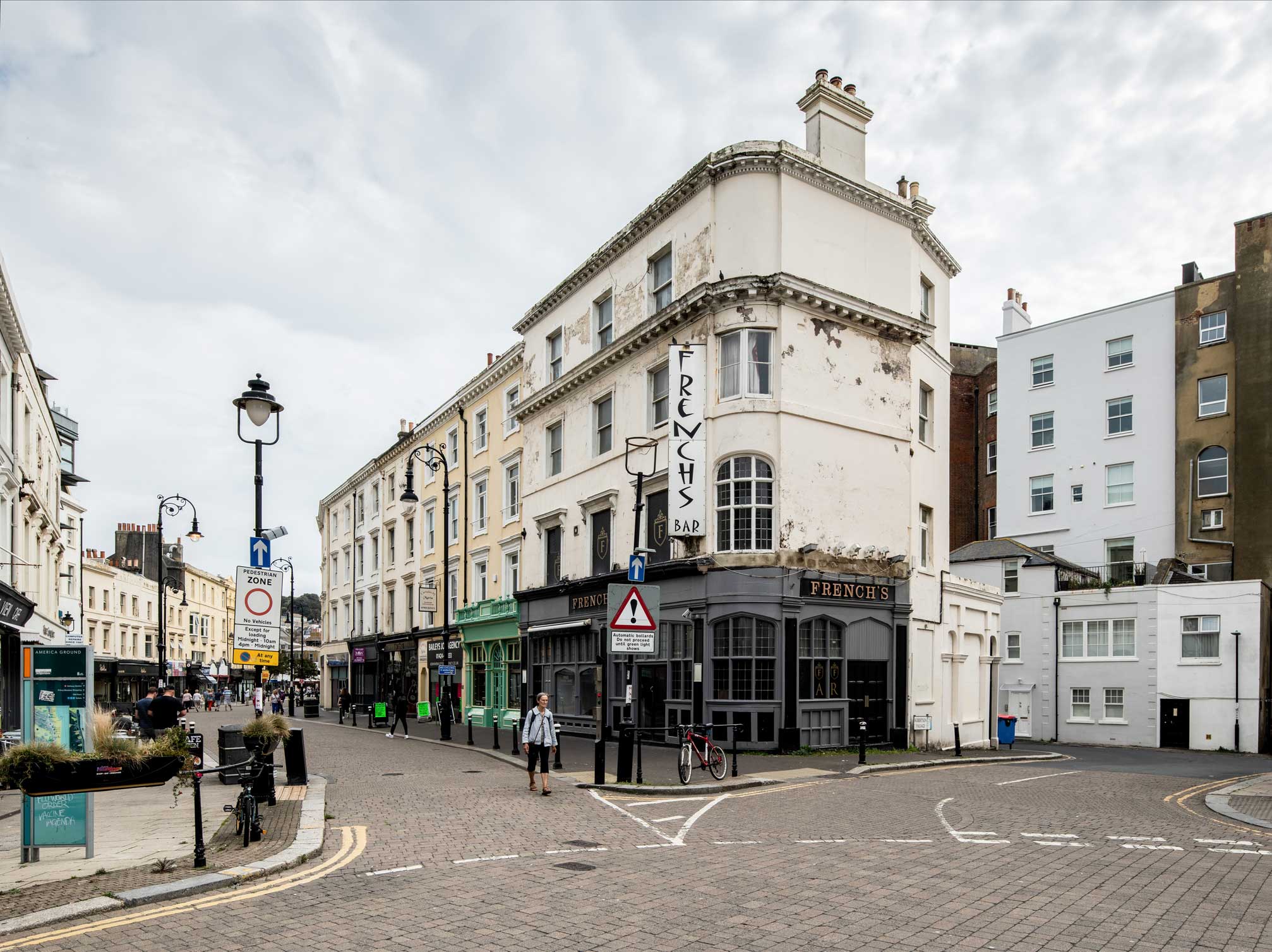 A street-level photo of a high street scene in Hastings, East Sussex.