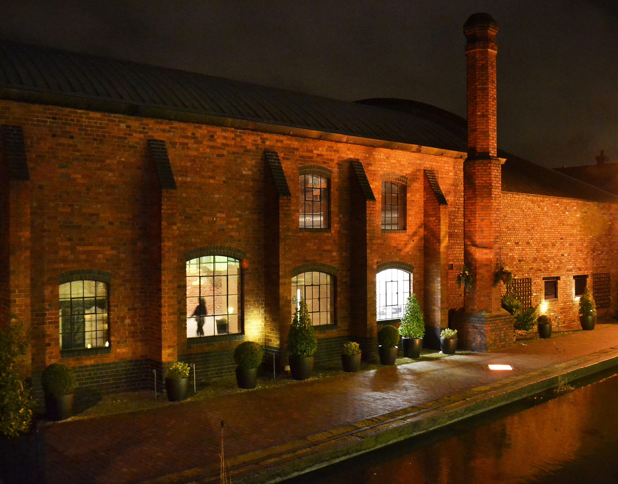 Photo of the outside of Gas Retort House at night