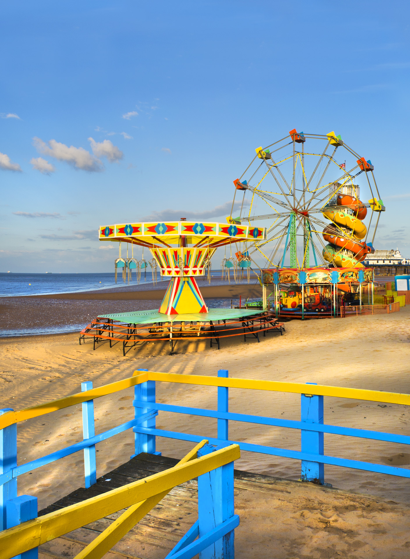 Colourful amusement rides on the beach at Mablethorpe, Lincolnshire.