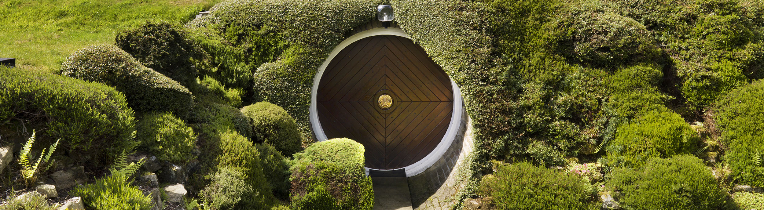 Image of the entrance to Underhill in Holme, West Yorkshire. Designed by Arthur Quarmby, Underhill is Britain’s first modern earth-sheltered house and has been described as a luxury hobbit’s home because of its captivating design.