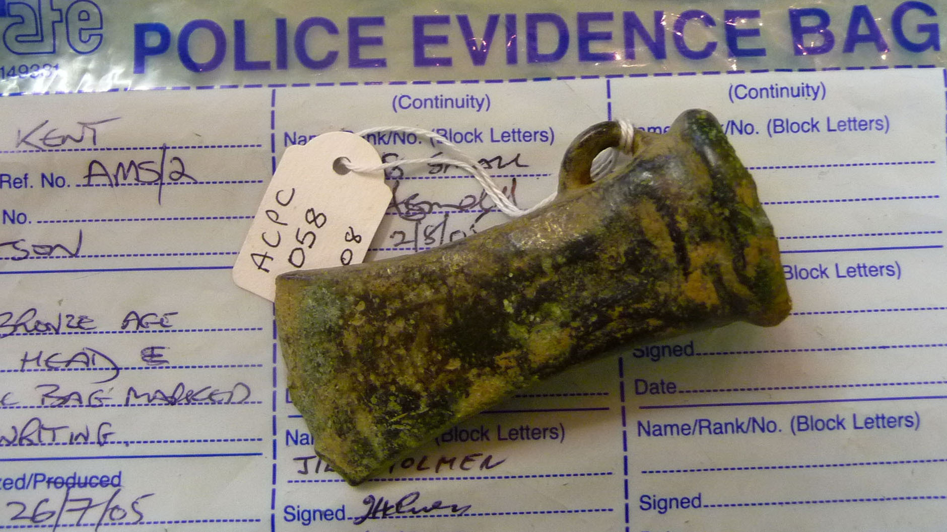 Bronze age axe head in police evidence bag