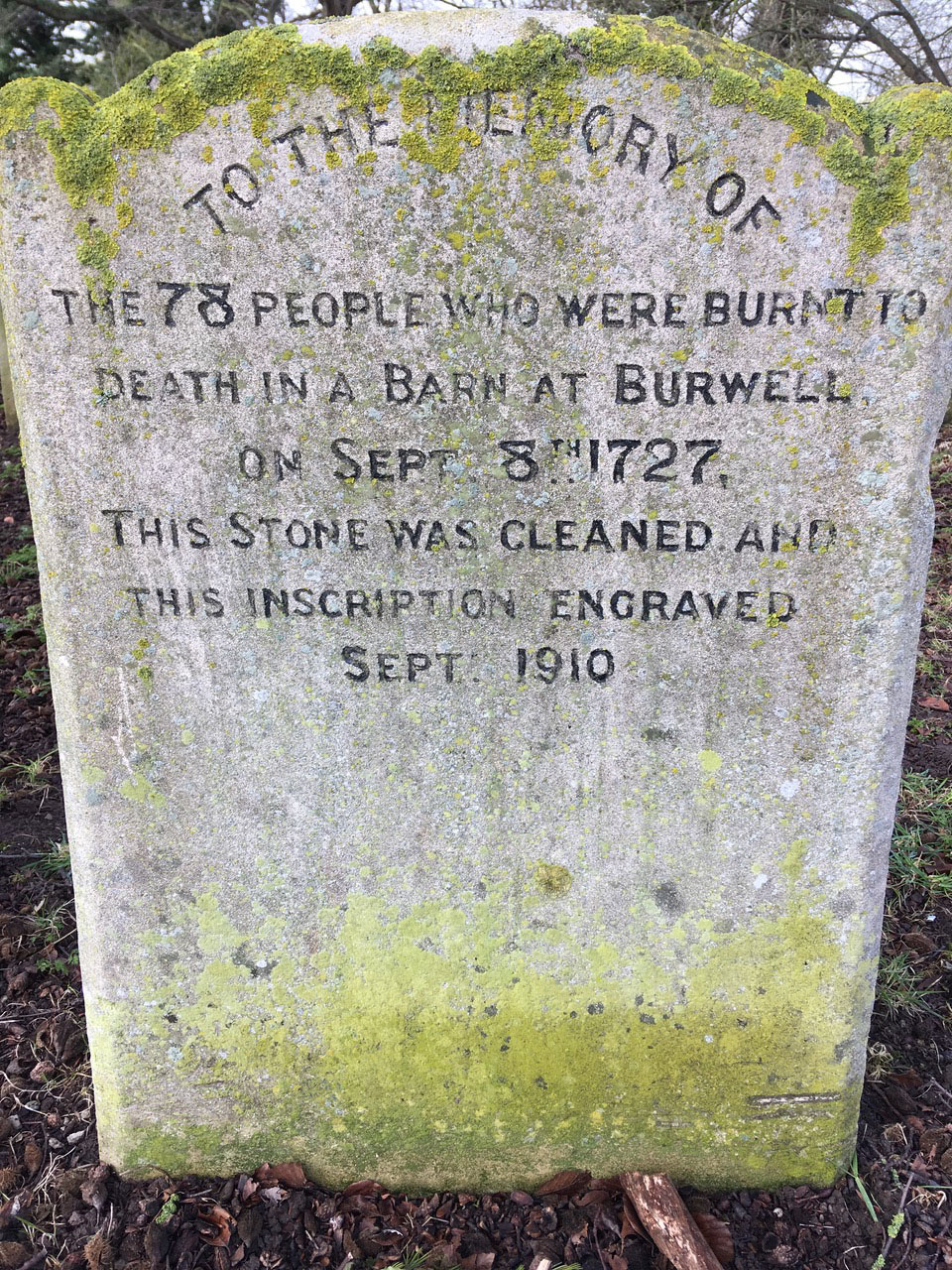 Flaming Heart Gravestone reads - To the memory of the 78 people who were burnt to death in a barn at Burwell on Sept 8th 1727, this stone was cleaned and this inscription engraved Sept 1910