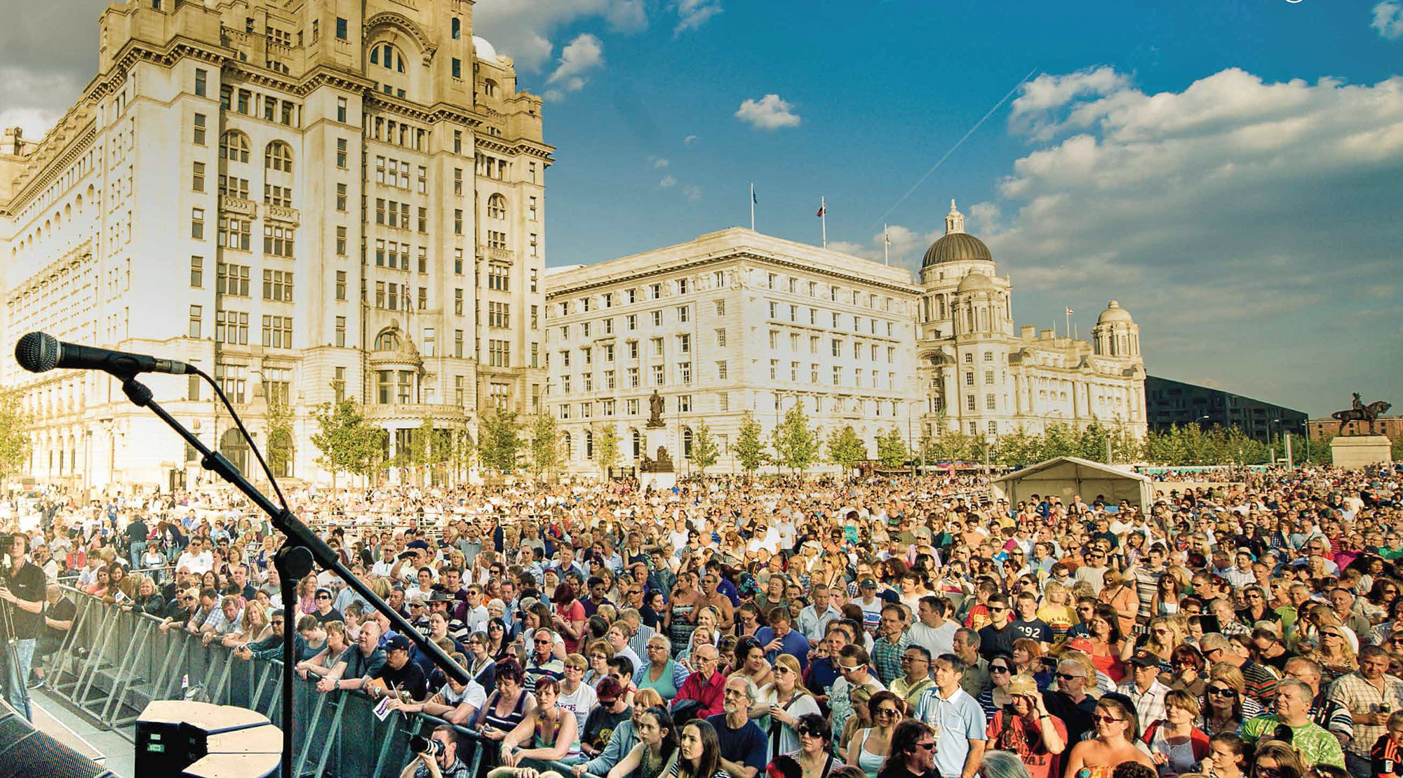 People attending open air concert in front the the Liver Building