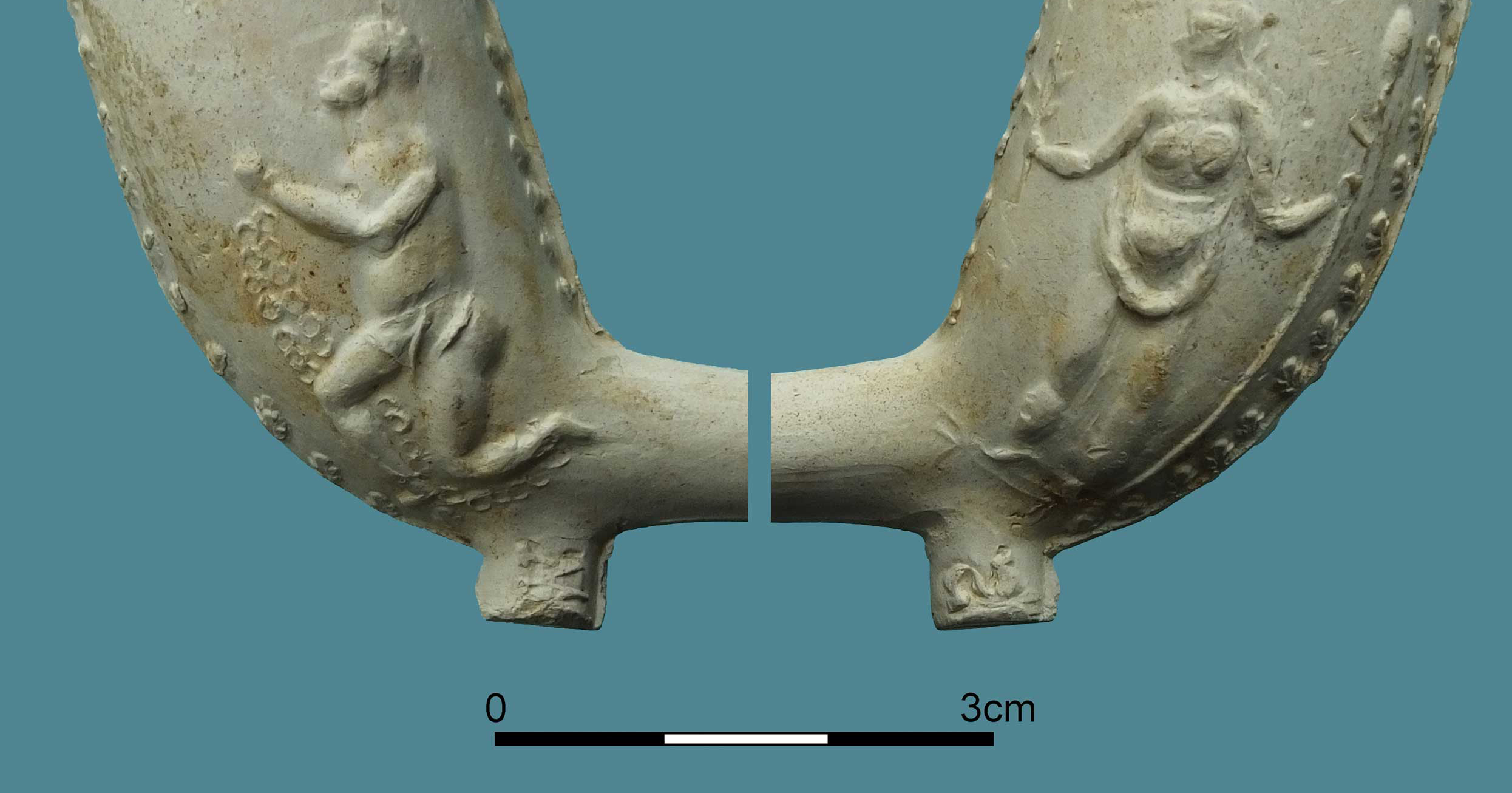 Detail of a clay pipe decorated to promote the abolition of the slave trade.