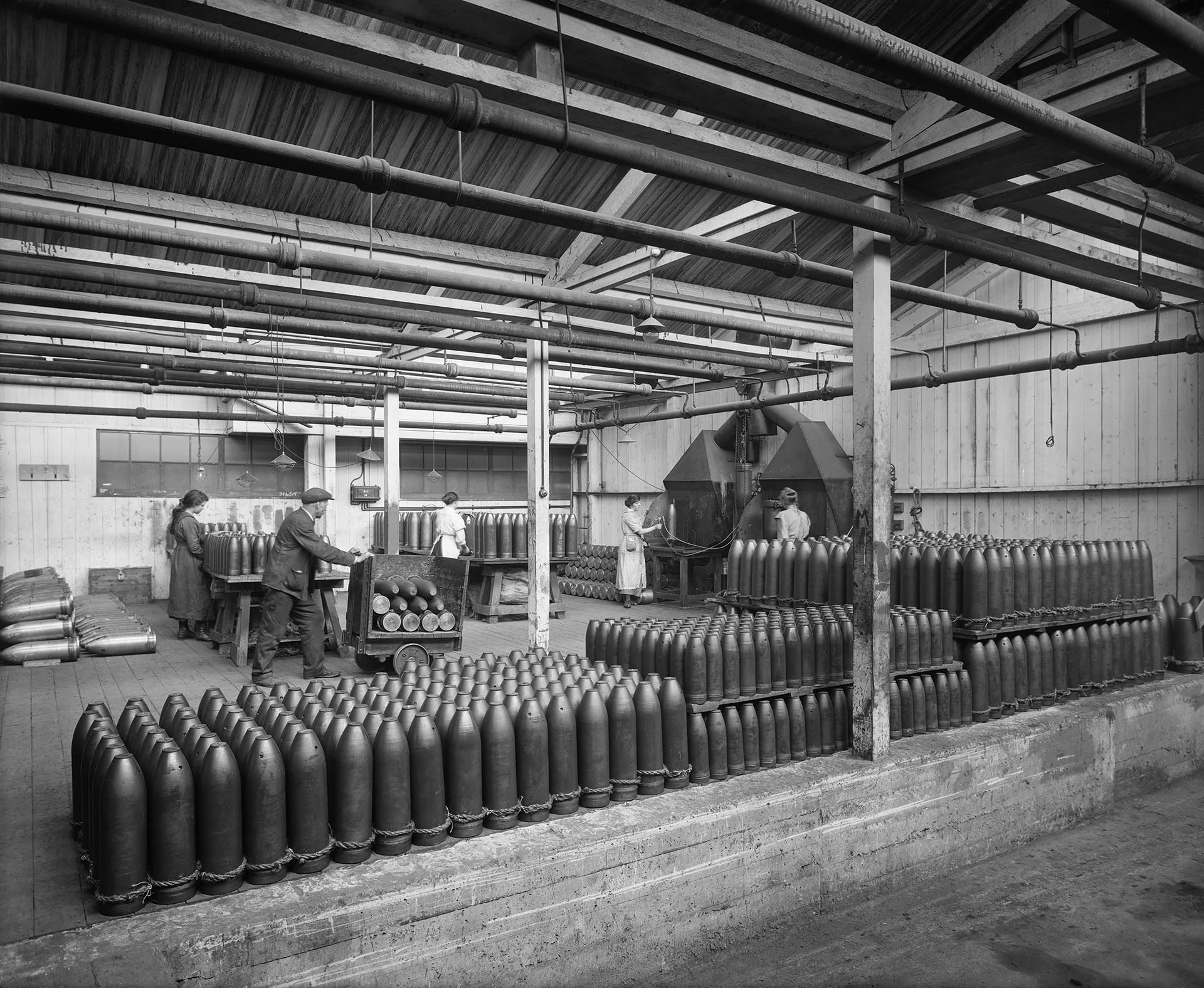 Cunards Shellworks, Liverpool, a man stacks finished shells in a loading bay ready for collection by a lorry.