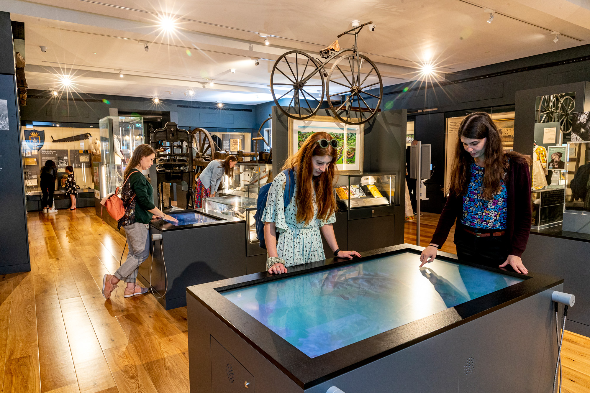 Visitors engaging with exhibits in a museum.