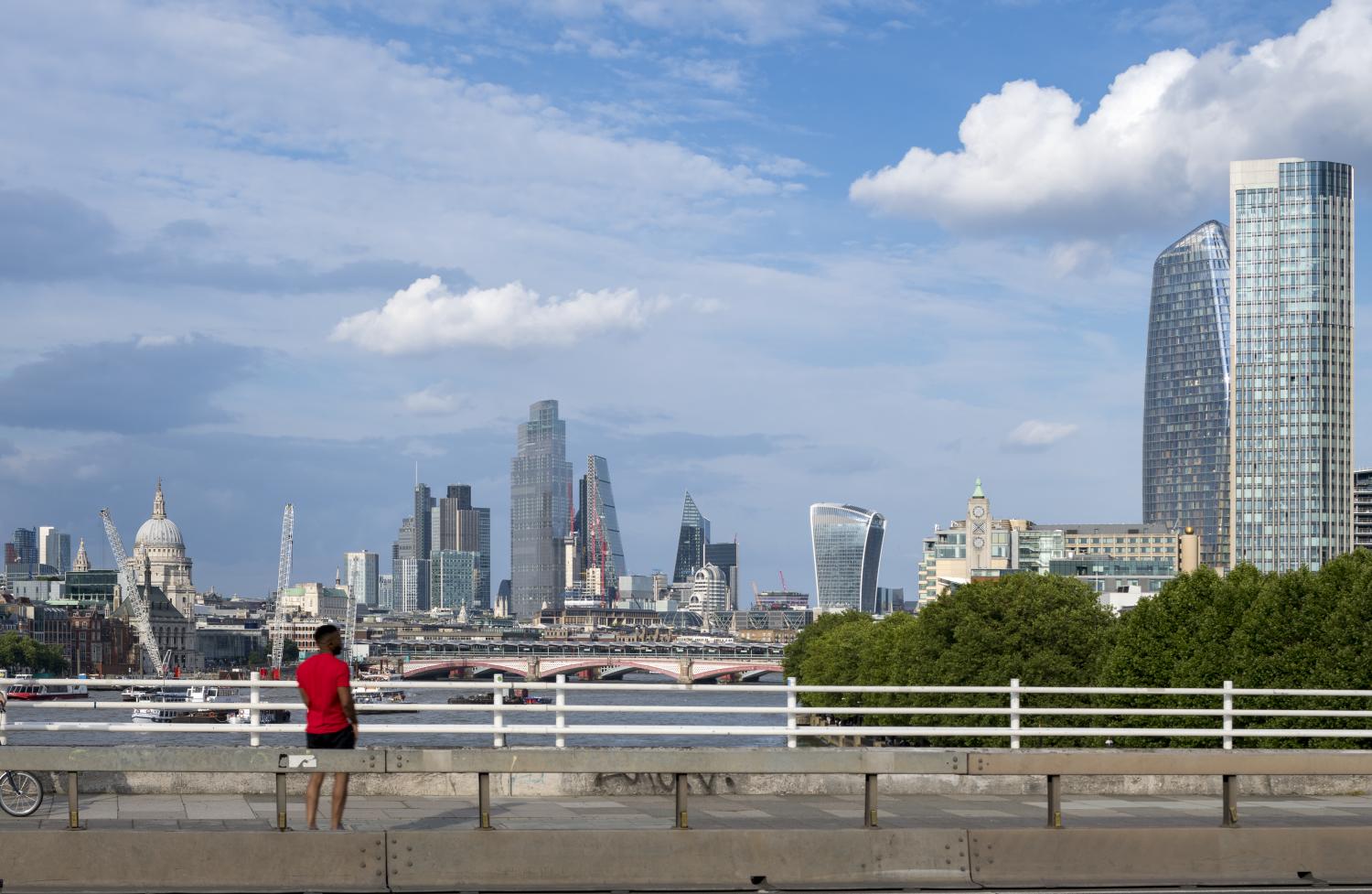 Photograph showing the view from Waterloo Bridge including St Paul's Cathedral, the skyscrapers of the City of London and the Oxo Tower in Lambeth.