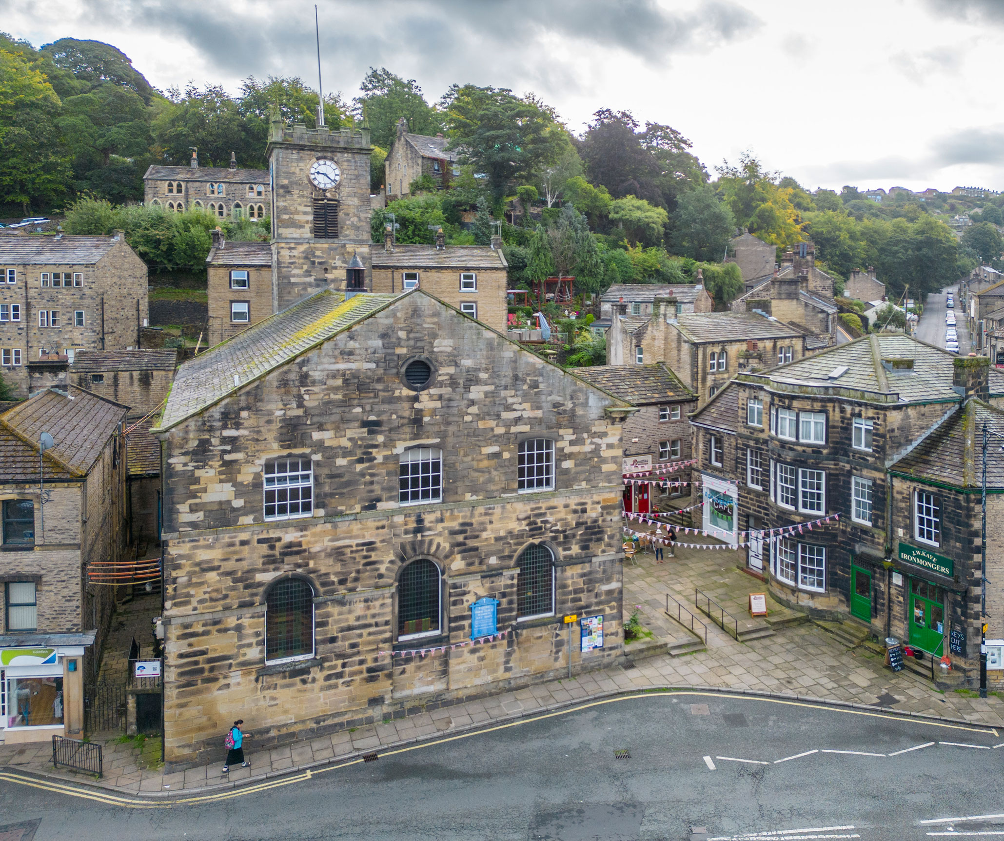 Exterior, drone image, view of church in wider context of conservation area, view from west with Sid's Cafe (Last of The Summer Wine TV location) beyond.