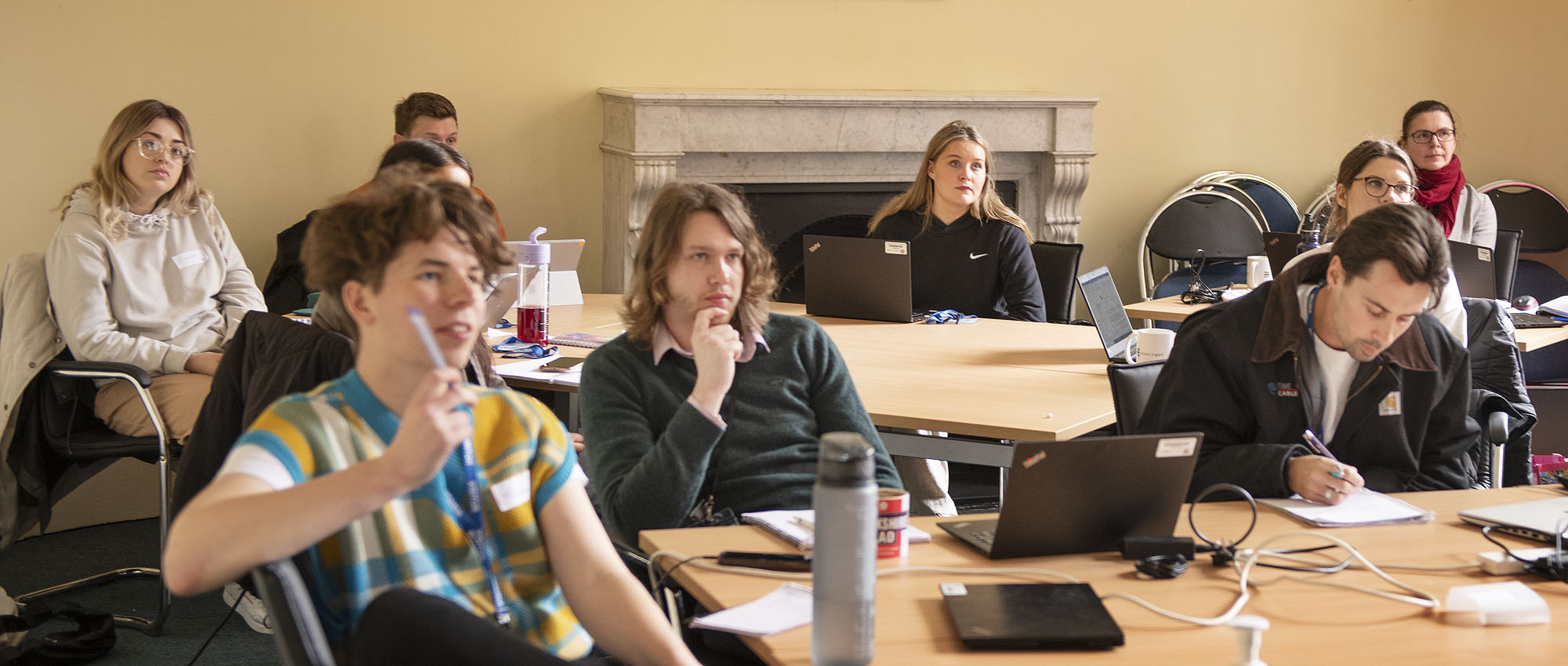 A group of people in a classroom setting