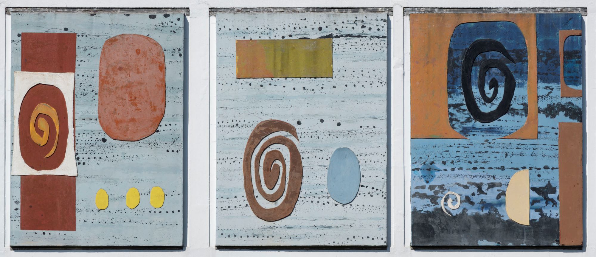 Three panels with colourful abstract shapes on blue backgrounds