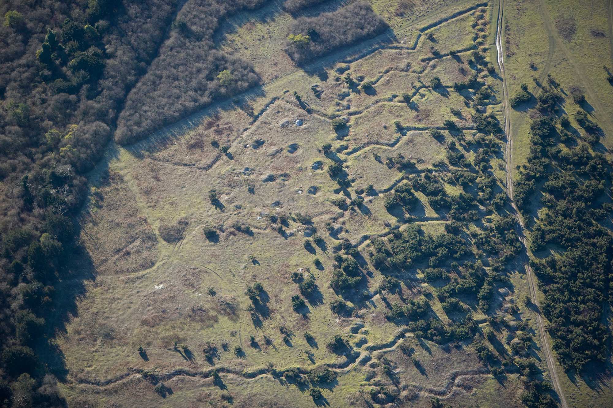 The earthwork patterns of practice trenches, Beacon Hill, Wiltshire, during the war the countryside became increasingly militarised as land was acquired for training areas, camps, airfields, and factories.