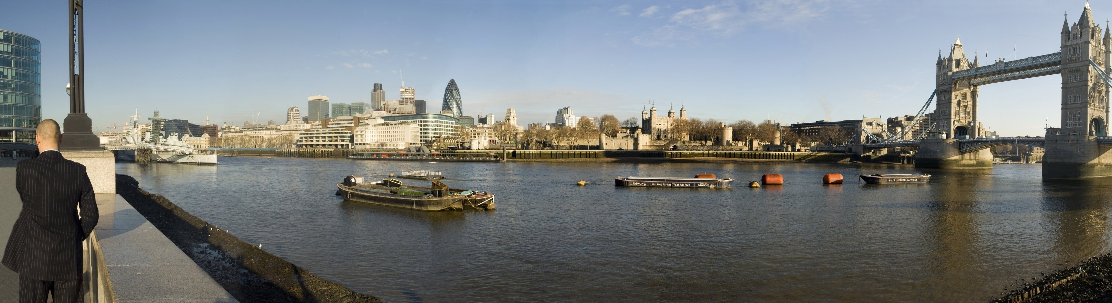 View of the skyline of London showing Tower Bridge, the 'Gherkin' building and HMS Belfast.