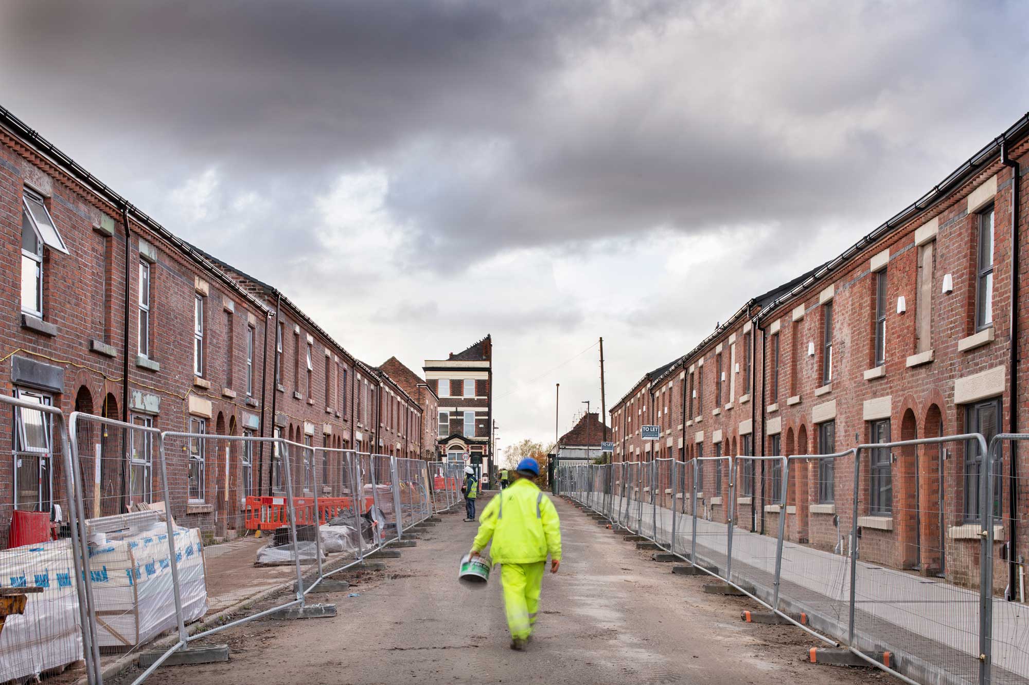 General view of Kimmel Street under building works with builder walking up the middle of the street.