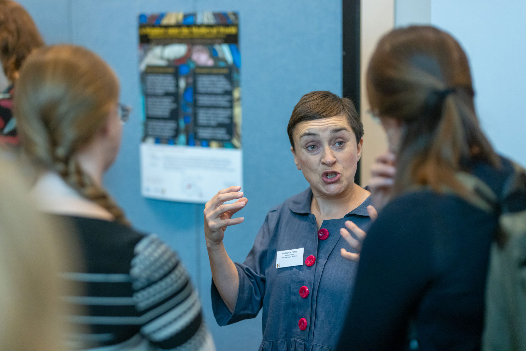 A group of students in discussion at a museum.