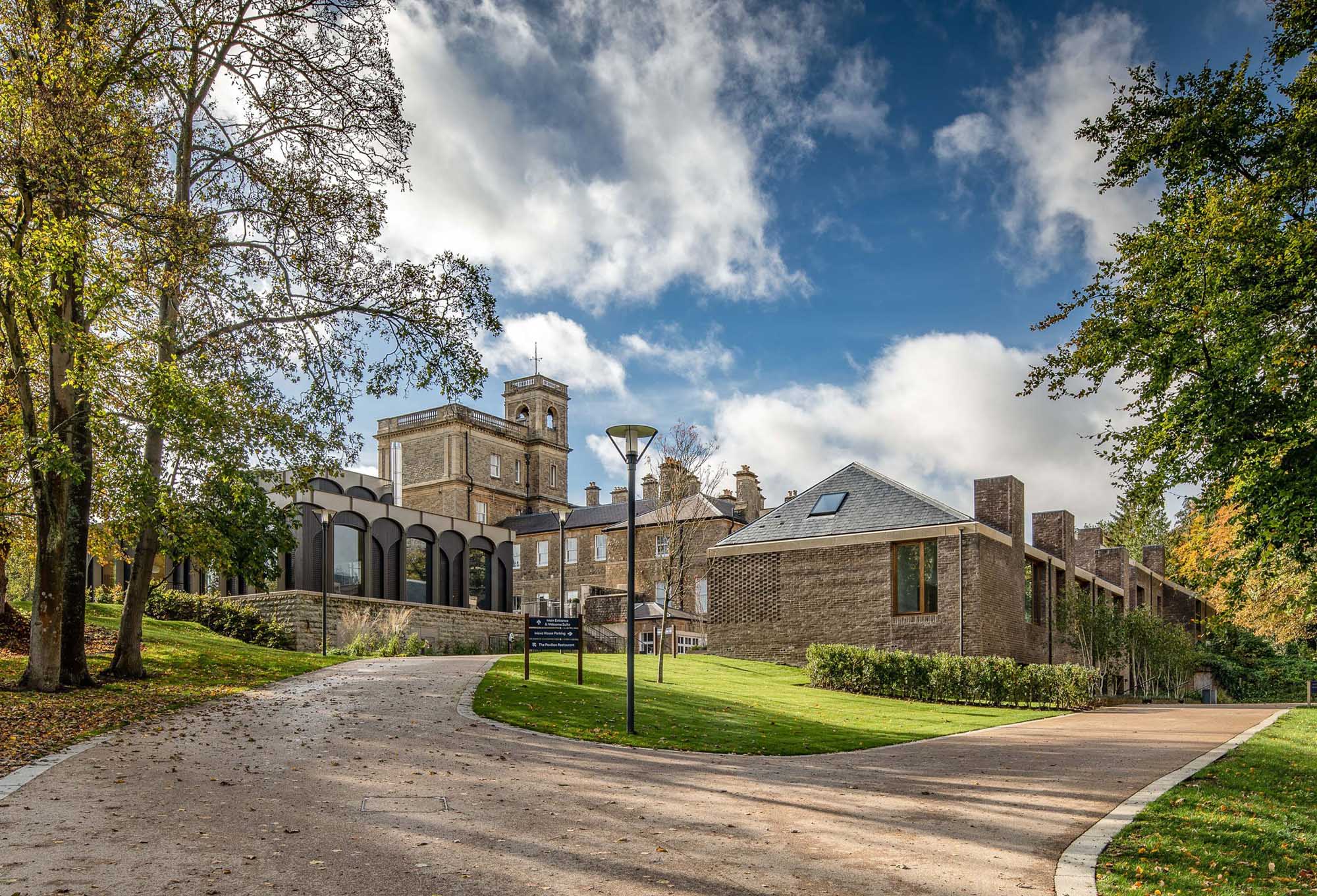View of an older country house with the addition of a modern mews style development.