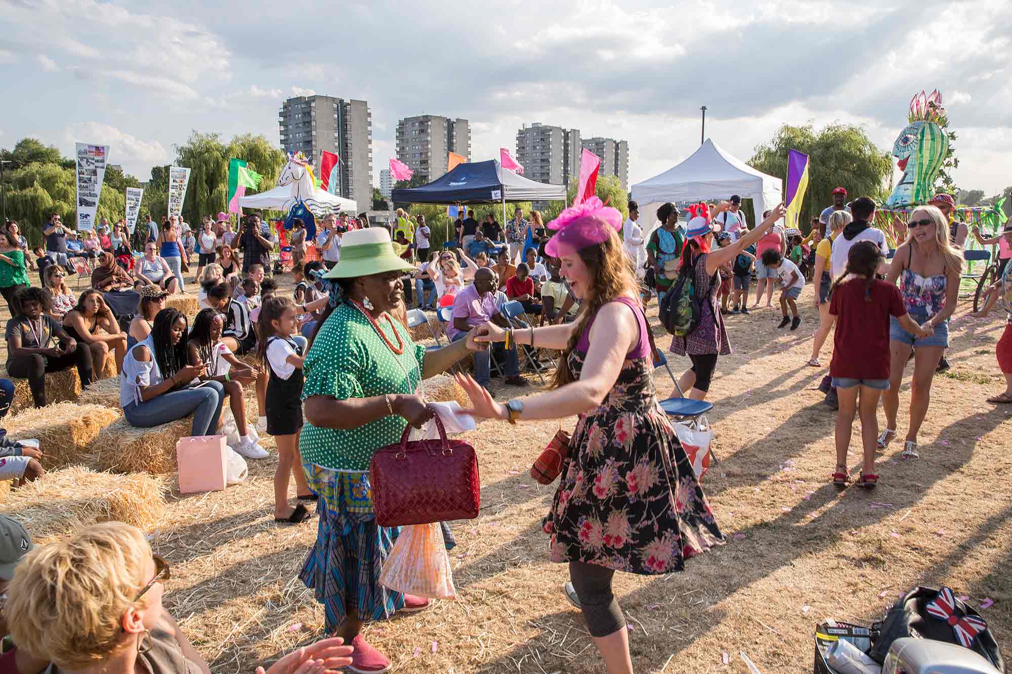 People enjoying Thamesmead Festival in the sun