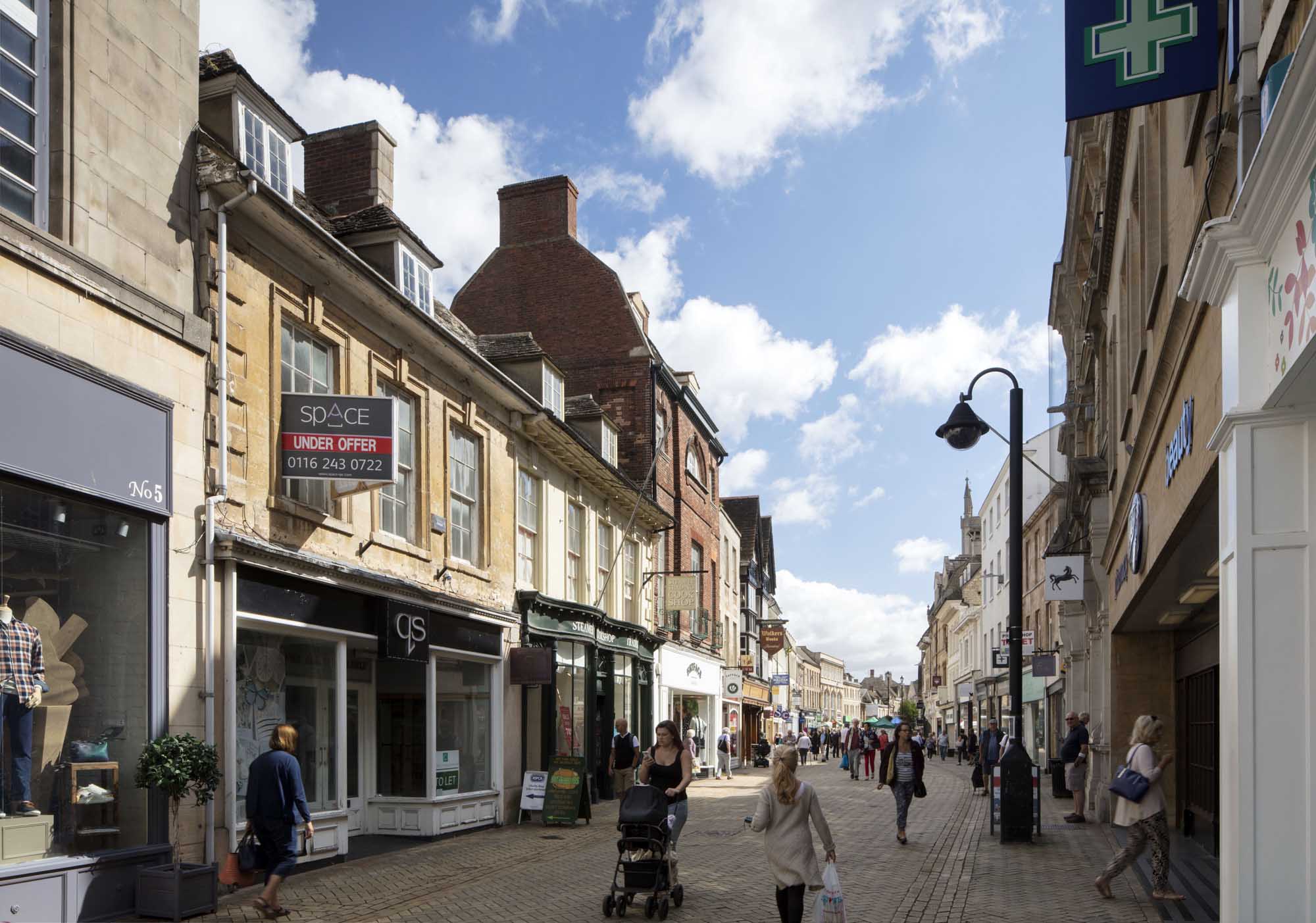 People walking down a shopping street
