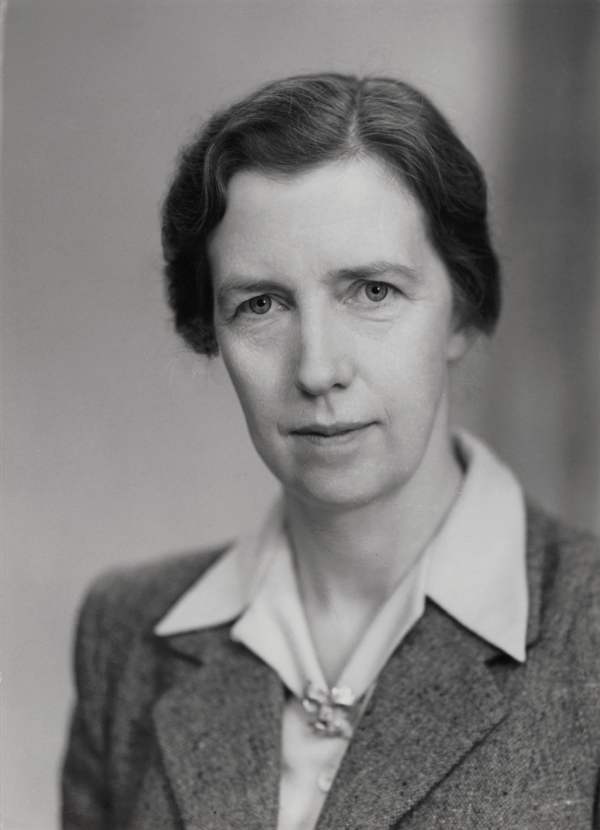 A black and white portrait photograph of a woman