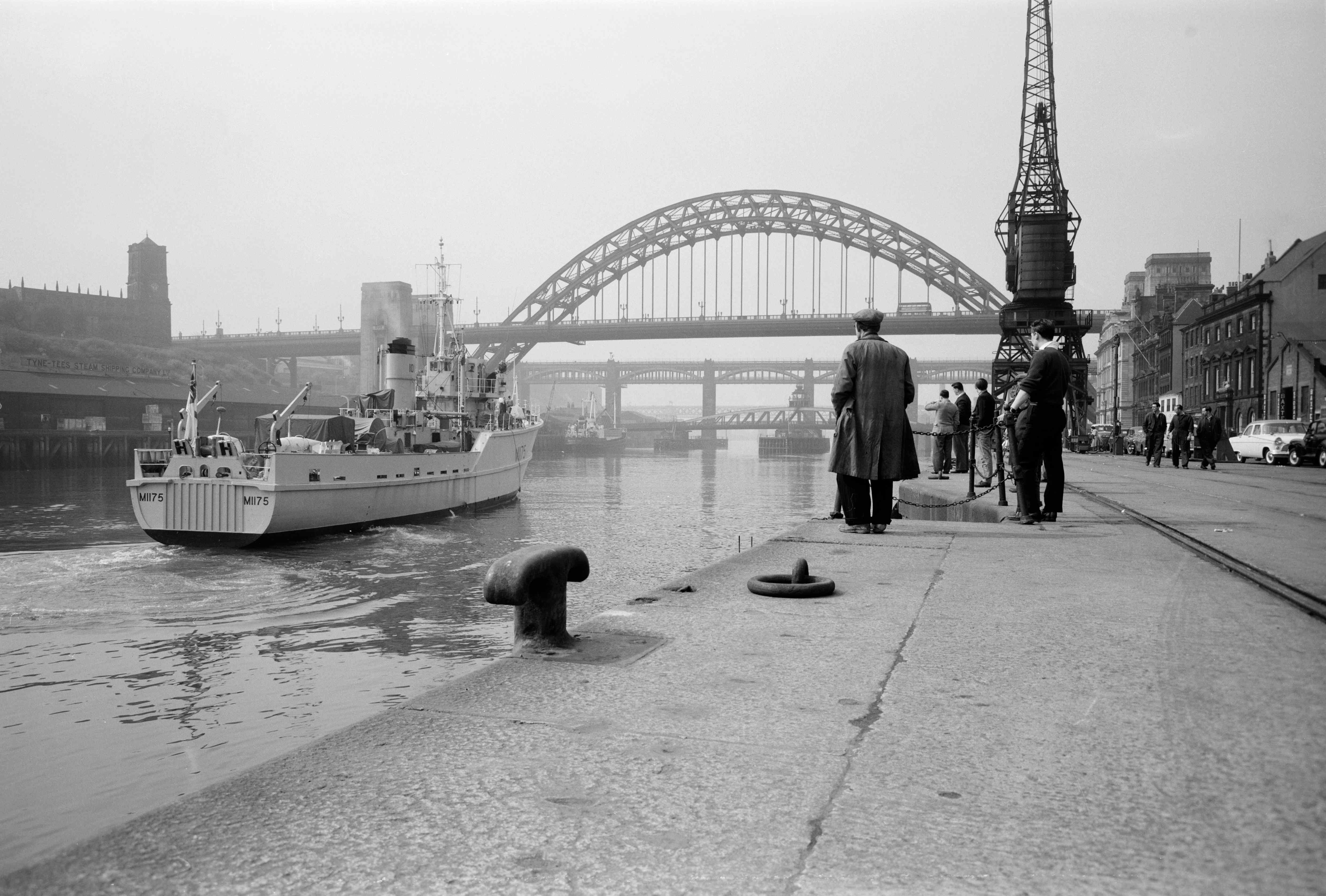 Black and white image of Tyne Bridge which spans the Tyne between Newcastle and Gateshead. Photo taken by Eric de Mare from the quayside.