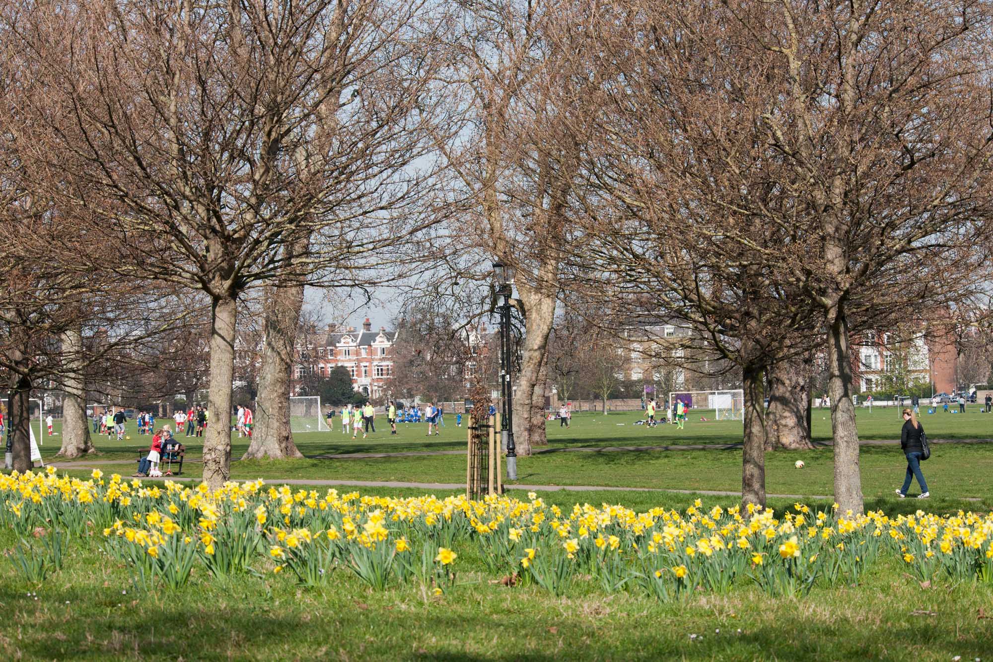 Visitors playing football at Clapham Common