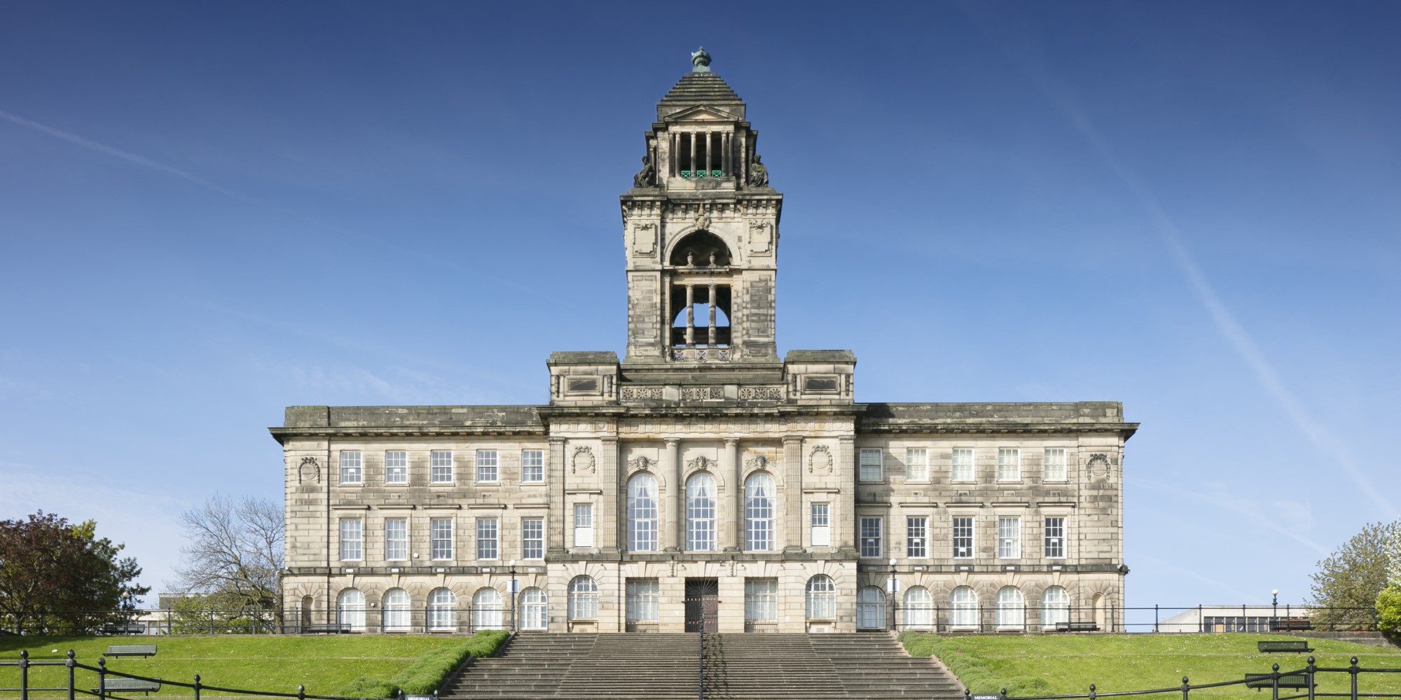 Town hall with central tower against blue sky