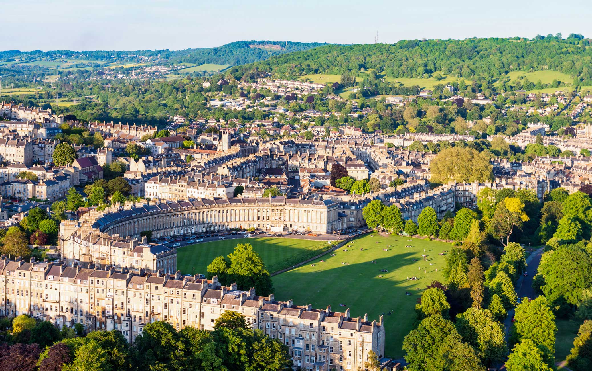 An aerial view of a Georgian crescent with surrounding streets and green spaces.