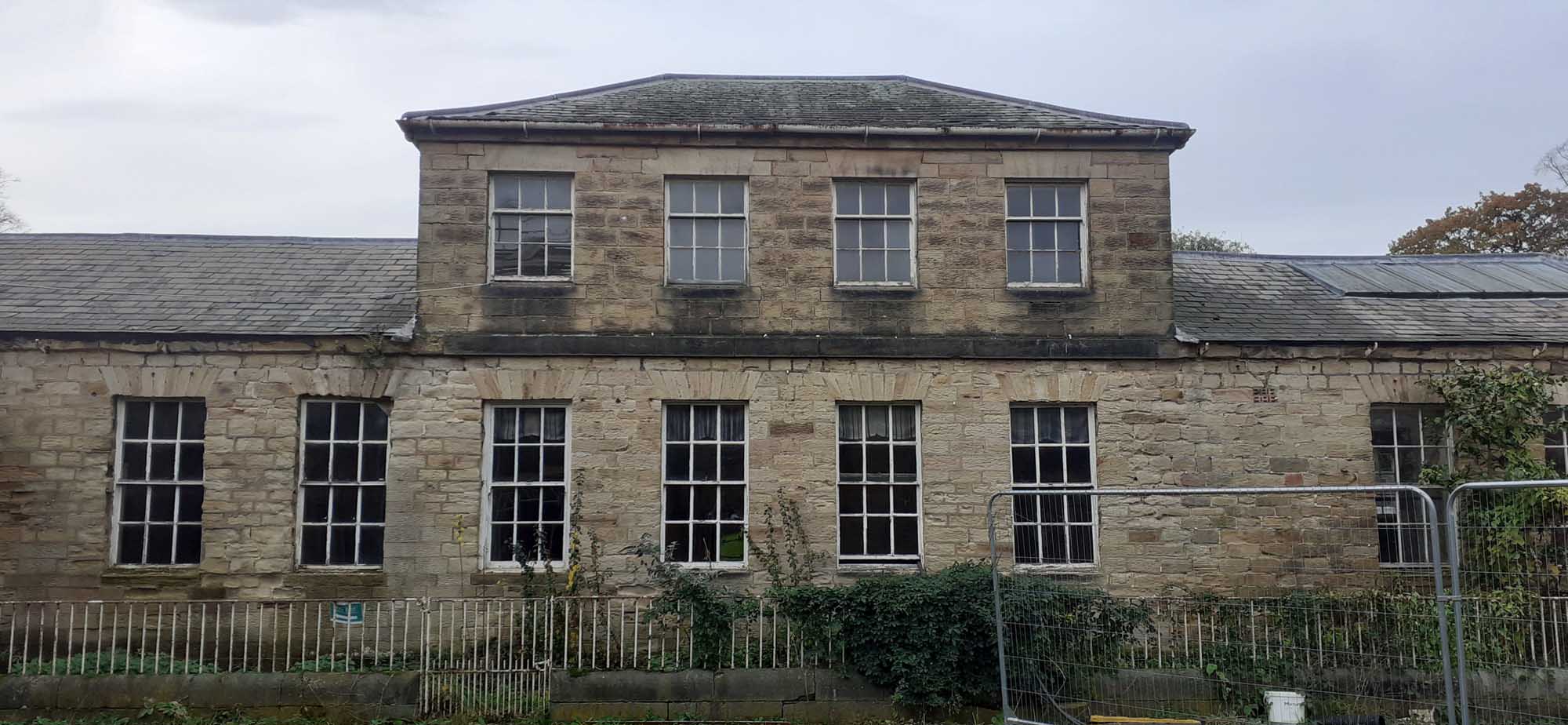 An old two storey stone building.