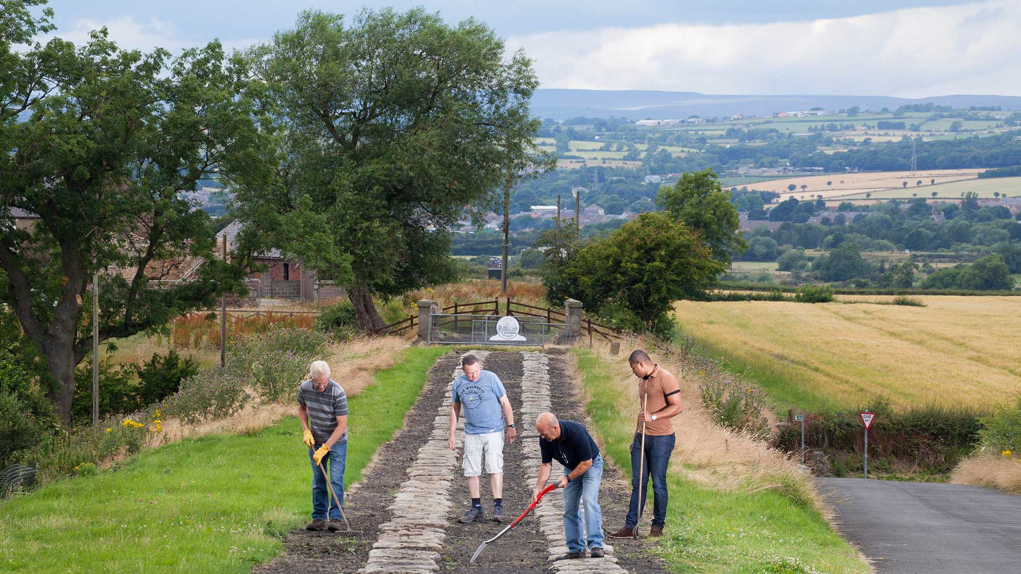 Group of men working on the rail line